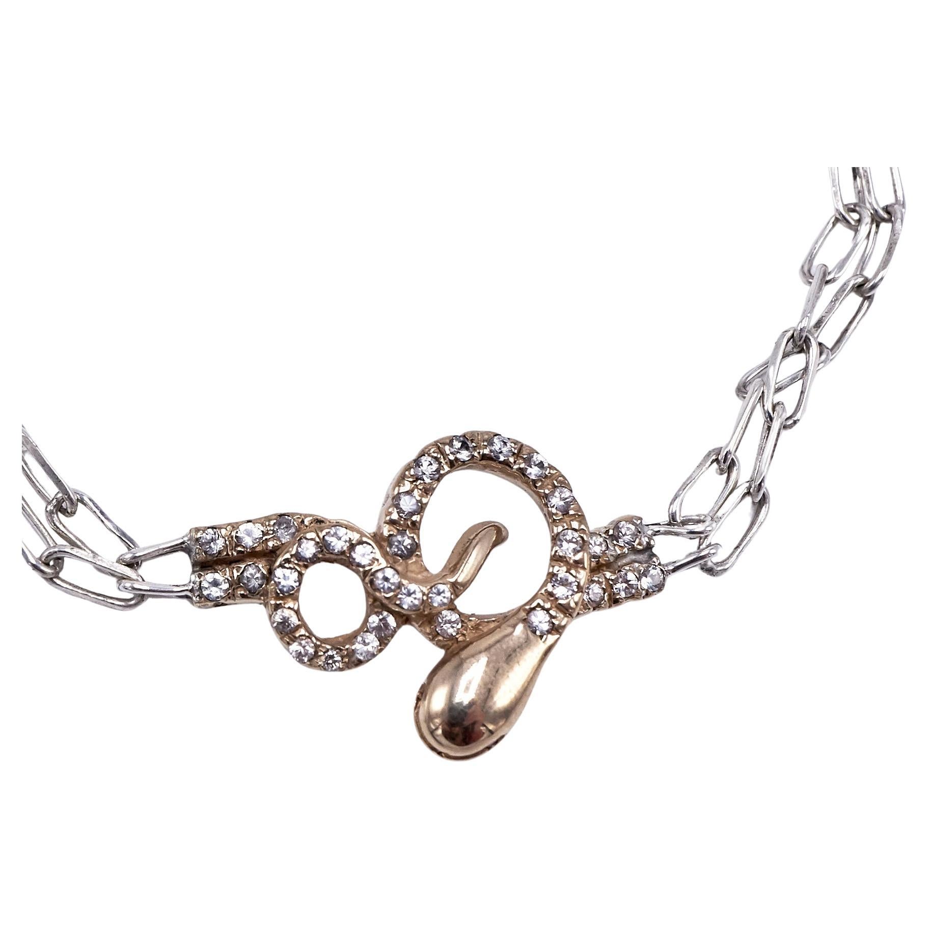Chaîne collier choker pendentif serpent en or et diamants blancs, yeux en argent et rubis