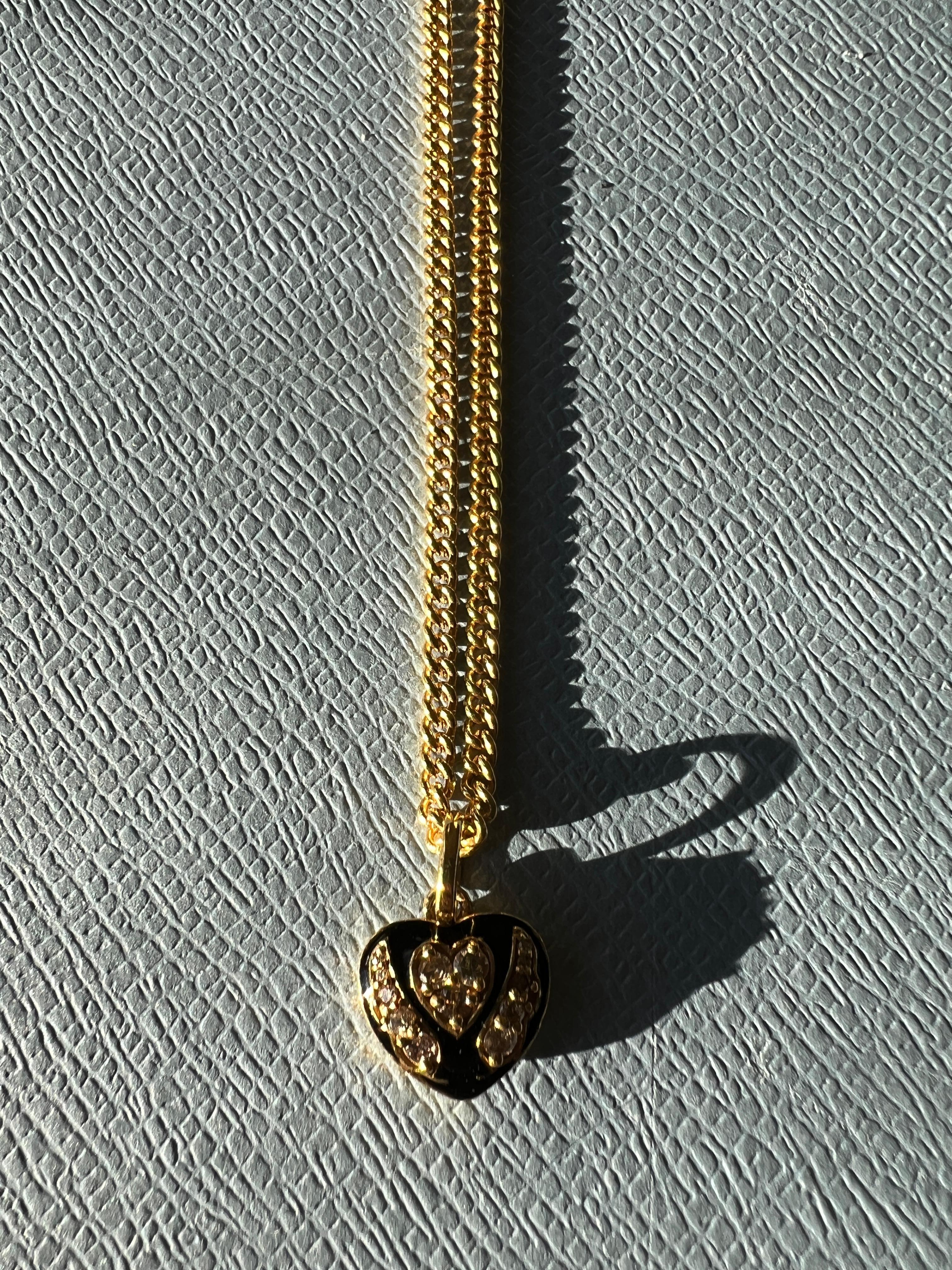 White Diamond Heart with angel wings Necklace 
Black Enamel 18 K Gold Plated Silver in Victorian Style

Length: Long 28
