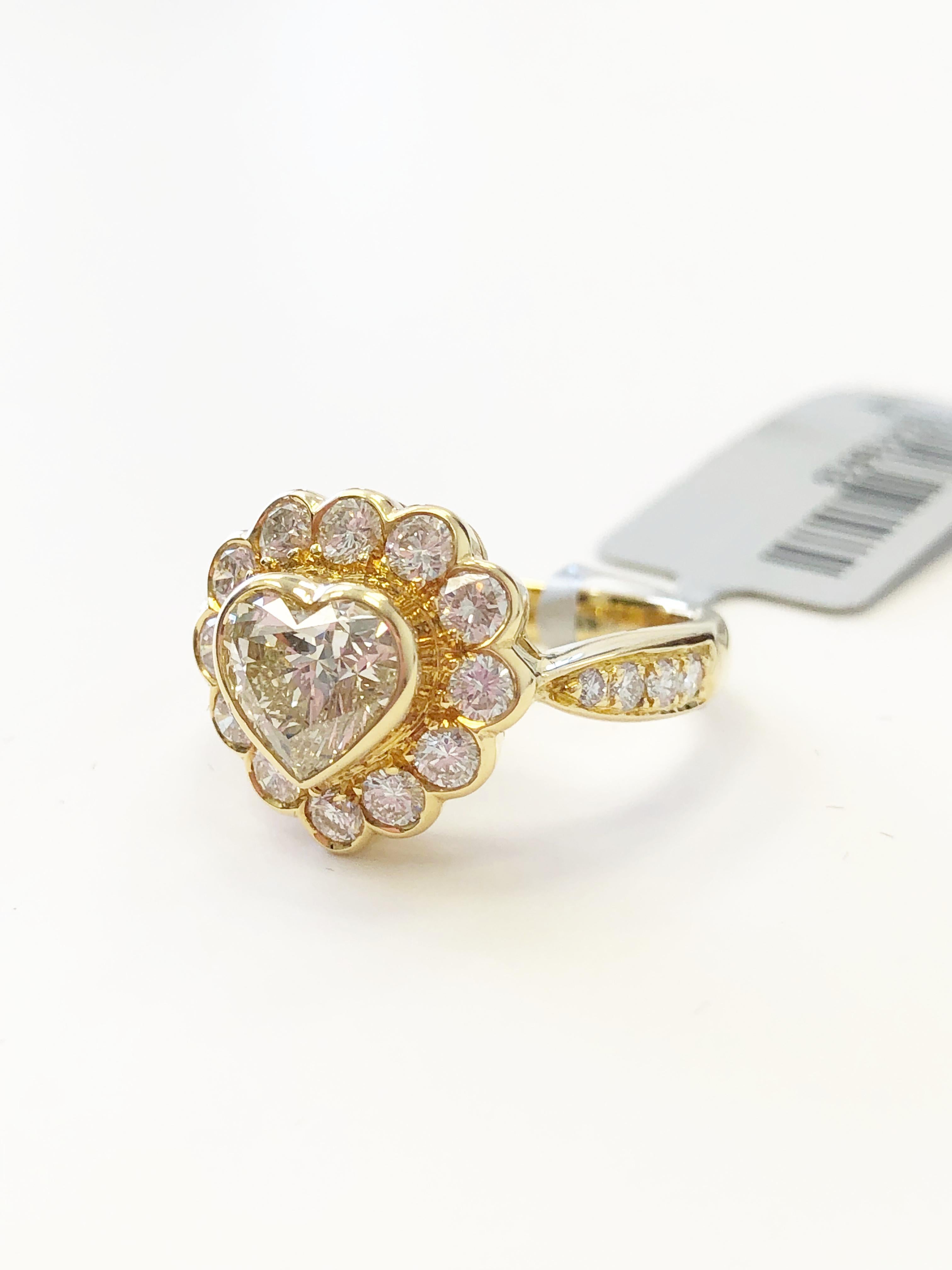 Stunning good quality bright heart shape weighing 1.18 carats with 0.91 carats of diamond rounds.  Handcrafted 18k yellow gold mounting in size 6.25.  This can be an engagement ring or a right hand cocktail ring.  Versatile and classic!

