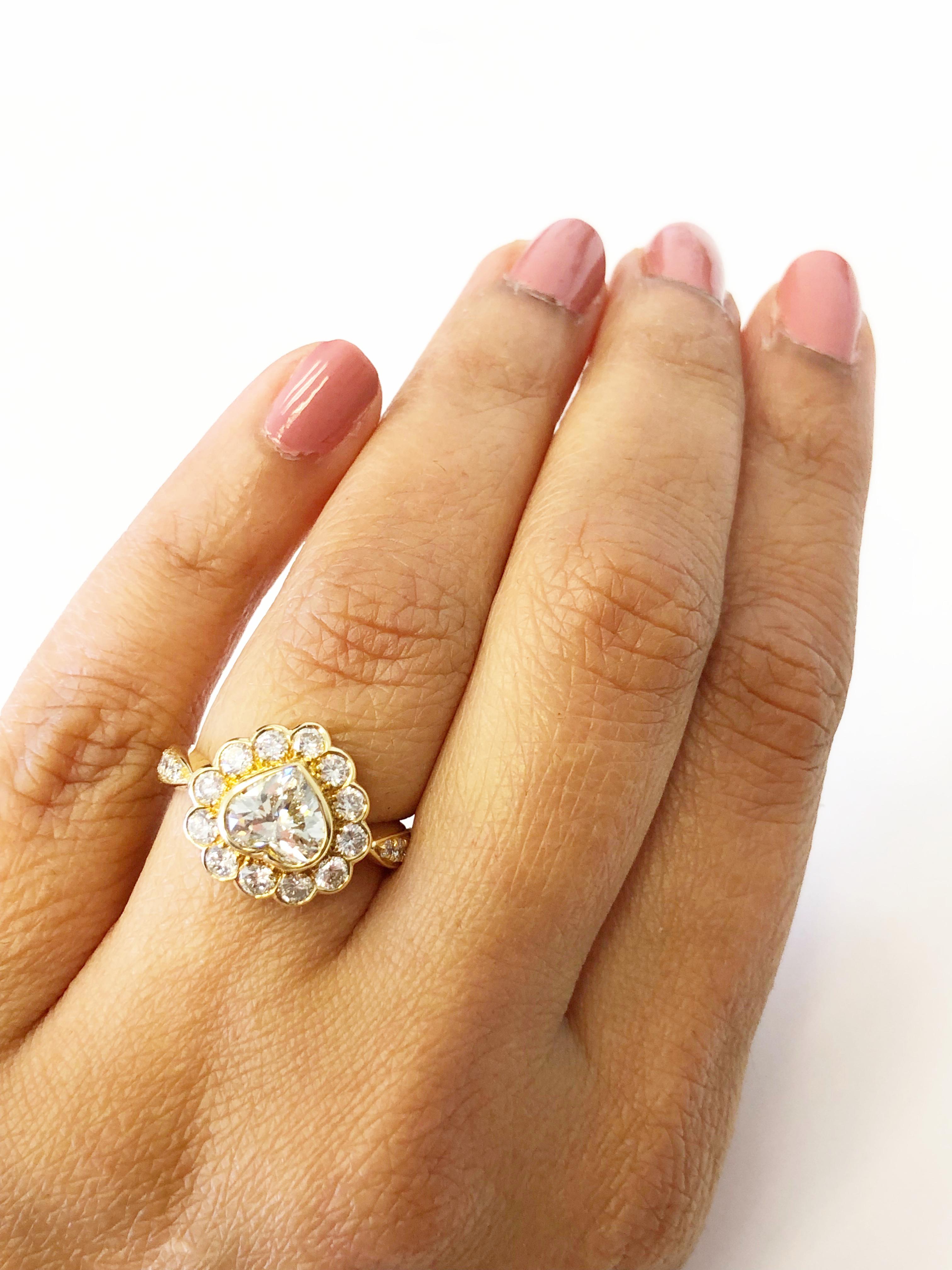 Round Cut White Diamond Heart Shape Engagement Ring in 18 Karat Yellow Gold
