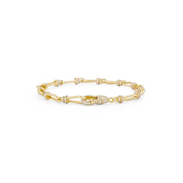 An 18k gold medium links bracelet embellished with a fully diamond encrusted diamond hook that opens and a white diamond pave links. Designed to allow you to add and remove charms easily whether through the diamond hook clasps that opens or the gold