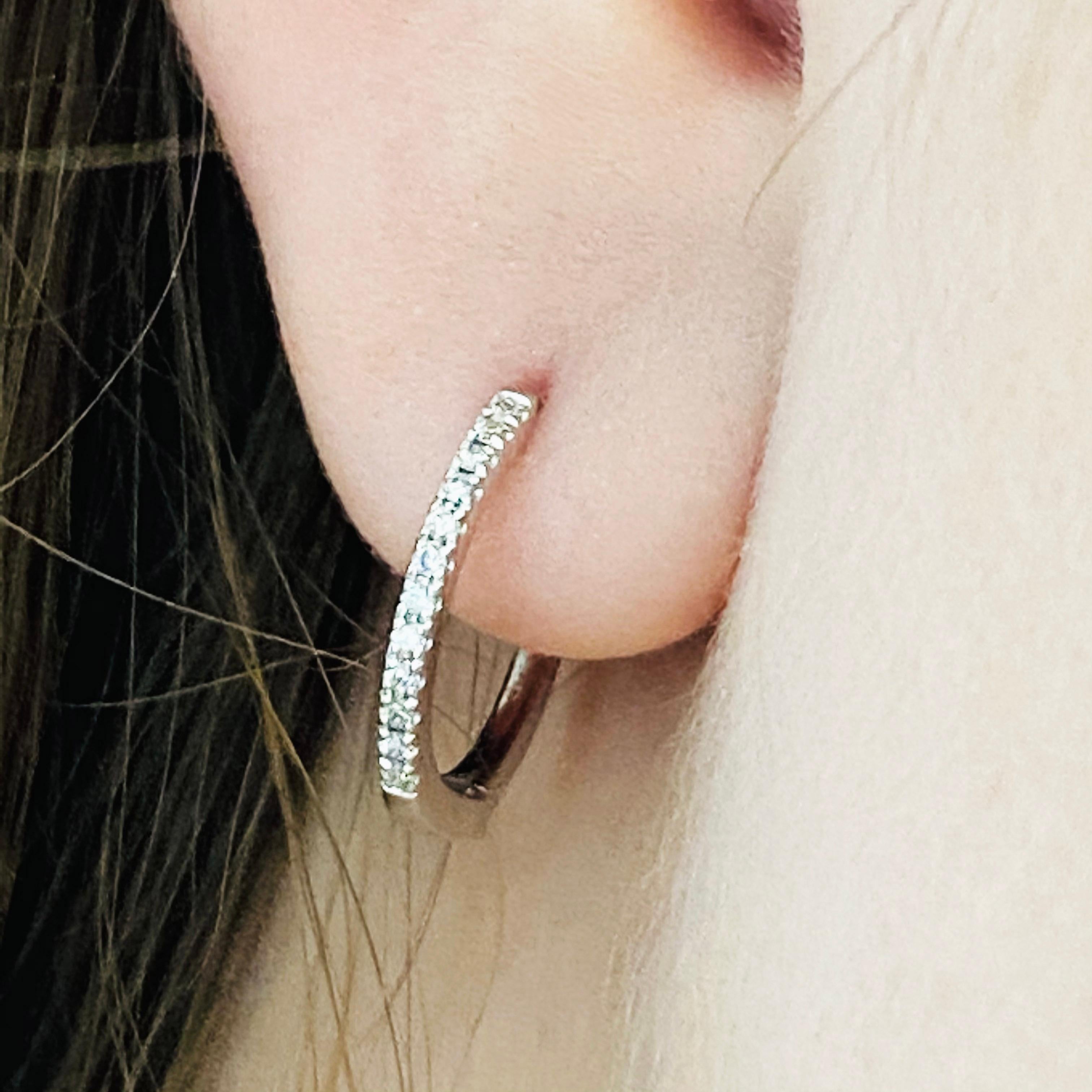 Our 2020 most popular earrings! These stunning polished 18k white gold diamond hoops provide a look that is both trendy and classic. While they were once worn by kings and queens to signify power and social status, hoop earrings are now considered a