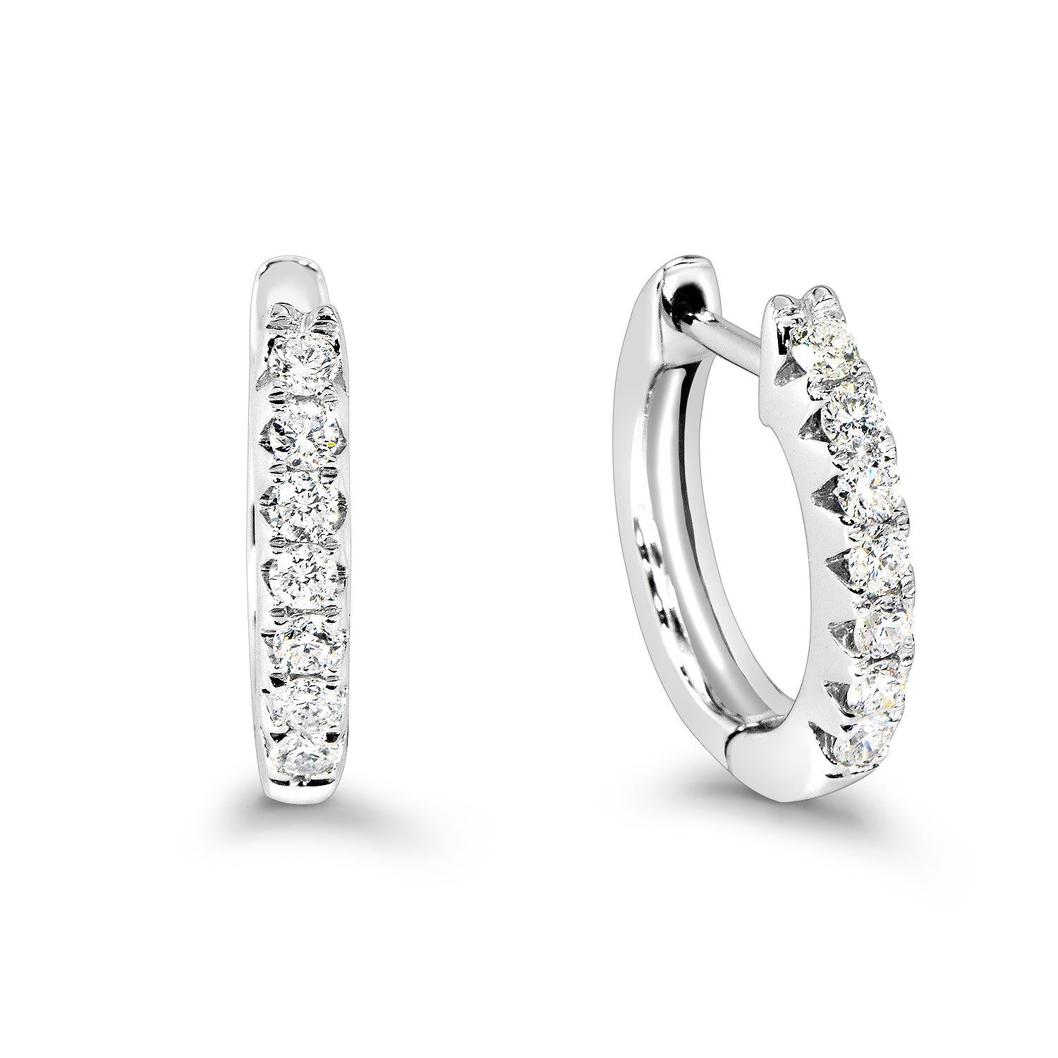Ladies beautiful diamond hoop Huggy earrings.
Contains .96 carat round brilliant diamonds total weight
16 diamonds are handset in prong setting.
Total weight 3.12 grams,14k white gold.
This beautiful earrings can be worn everyday and for special