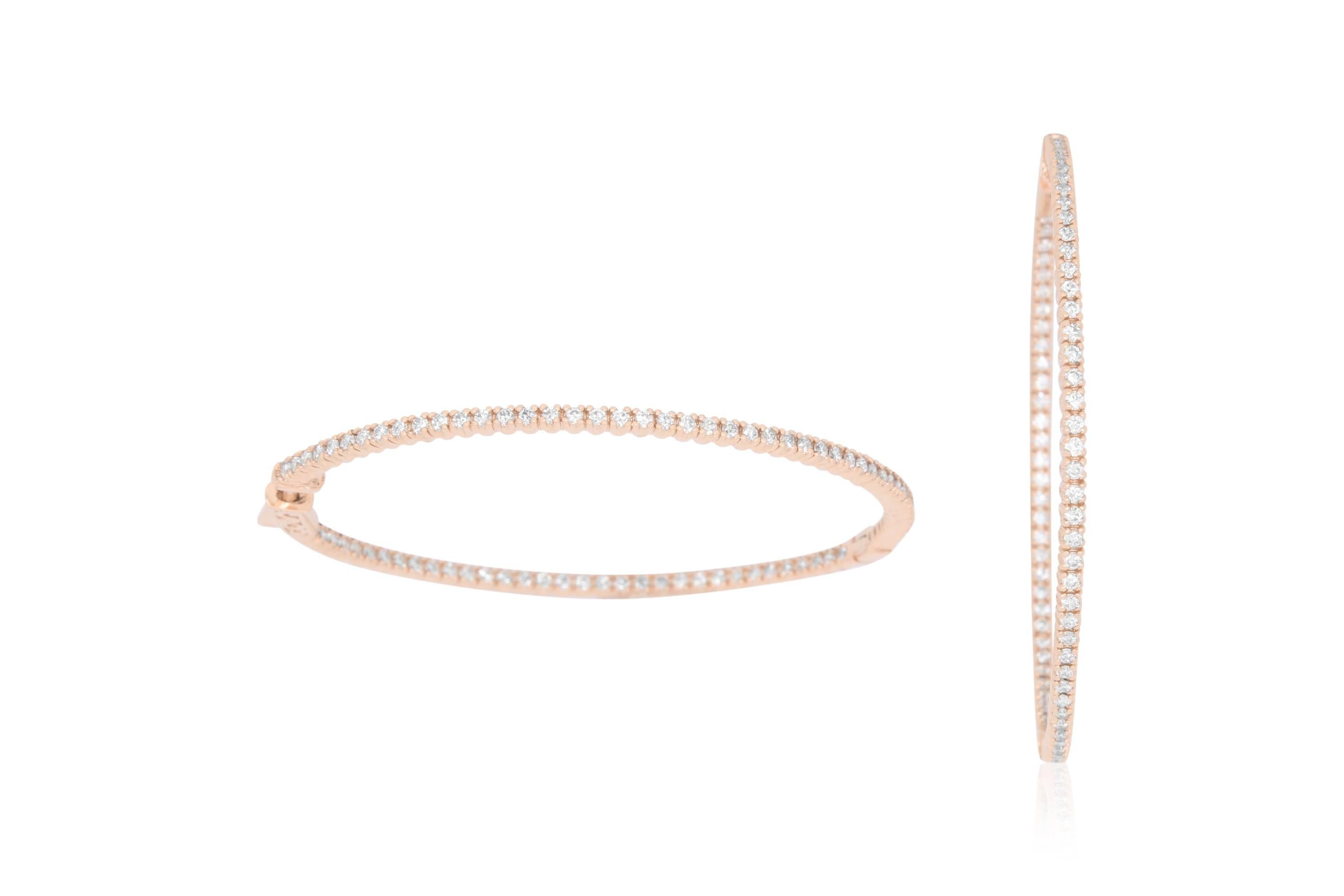 Beautiful & classic, these hoops will add sparkle and shine to any look.

Material: 14k Rose Gold 
Mounting Stone Details: 160 Round Diamonds at 1.60 Carat Total- Clarity: SI / Color: H-I
Approximately 2 inch diameter

Fine one-of-a-kind