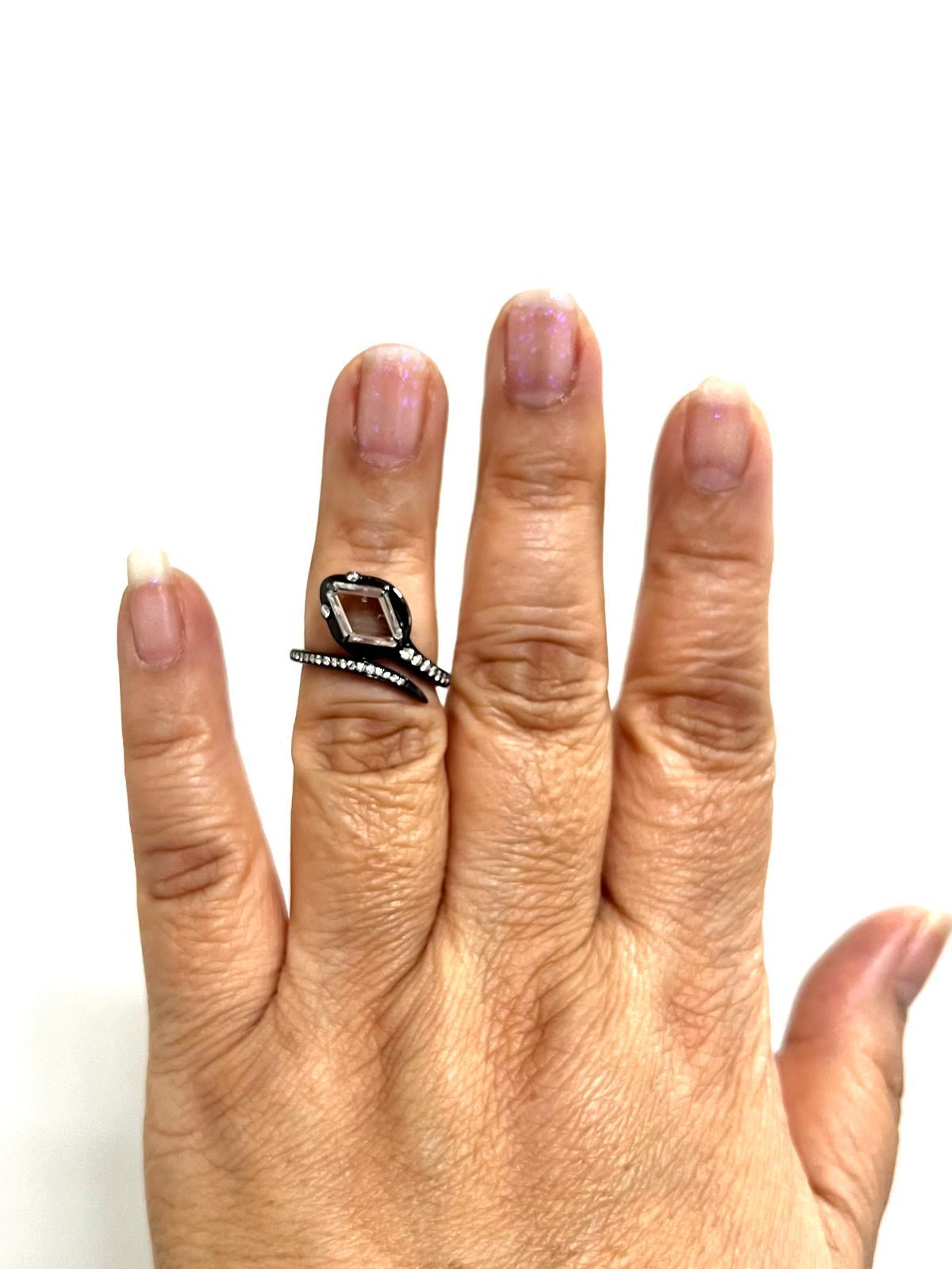 Beautiful 1.27 ct. white diamond kite shape with accent white diamond rounds.  Handmade in 18k white gold and black rhodium.  Ring size 6.75.  A great serpent style ring that is trendy yet classy.