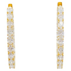 Boucles d'oreilles ovales en or jaune 18k avec diamants blancs