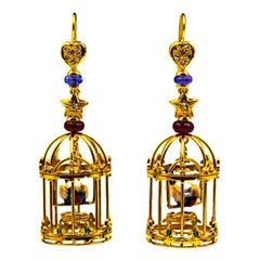Boucles d'oreilles "cage d'oiseau" en or jaune diamant blanc perle rubis tanzanite tsavorite