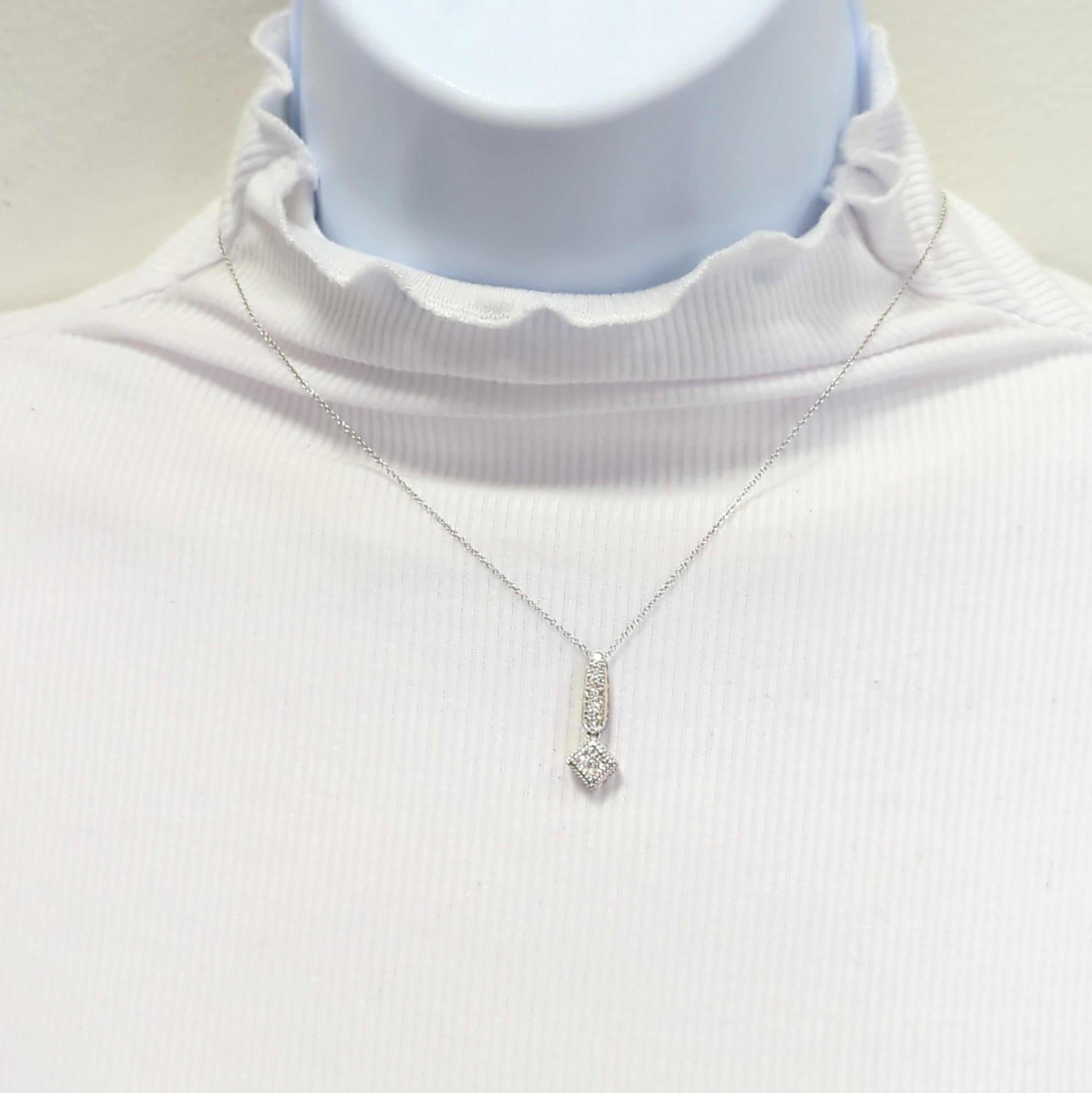 Beautiful pendant necklace with 0.28 ct. of round diamonds that are bright, white, and good quality.