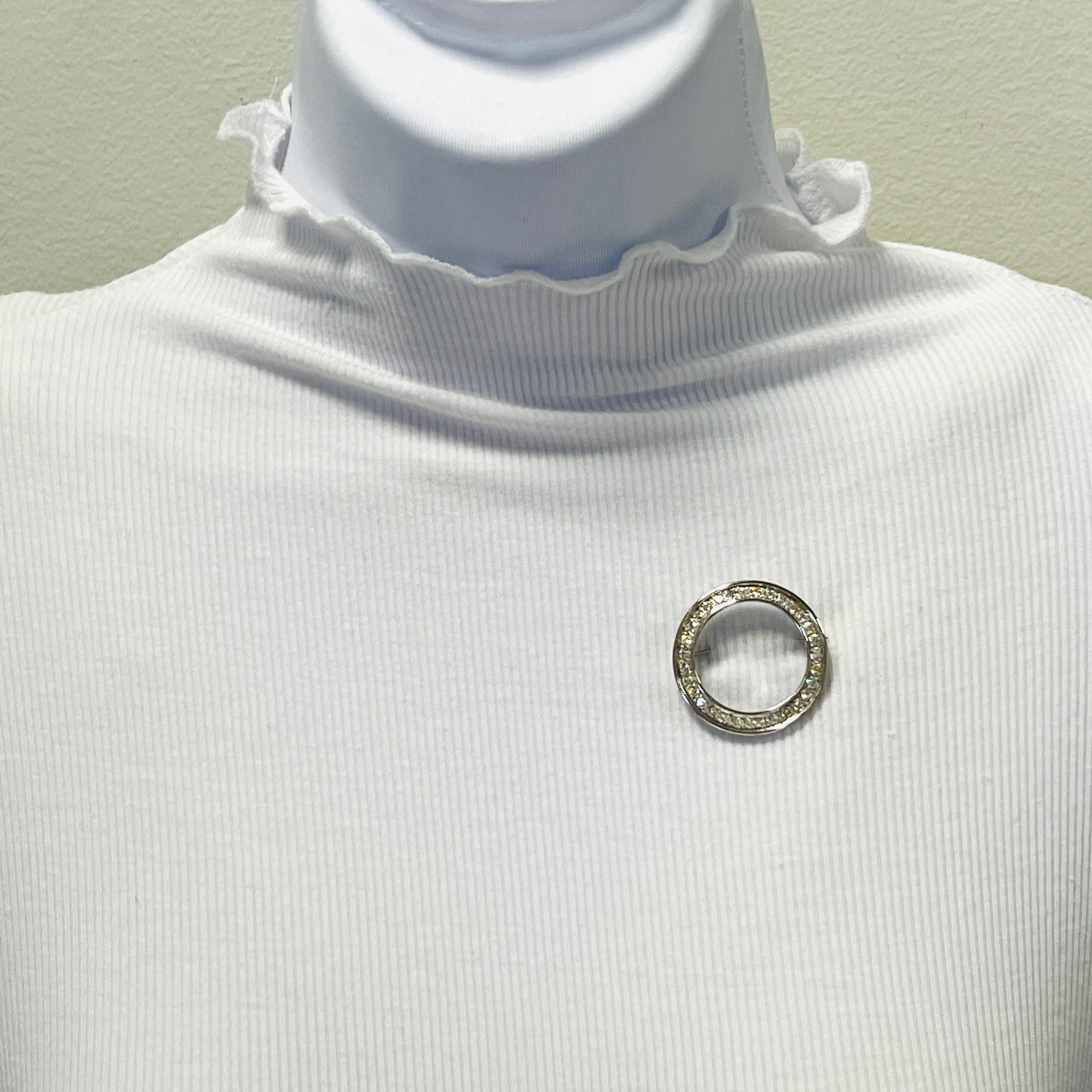 Beautiful pin/brooch with good quality, white, and bright white diamond rounds.  Handmade in platinum.  