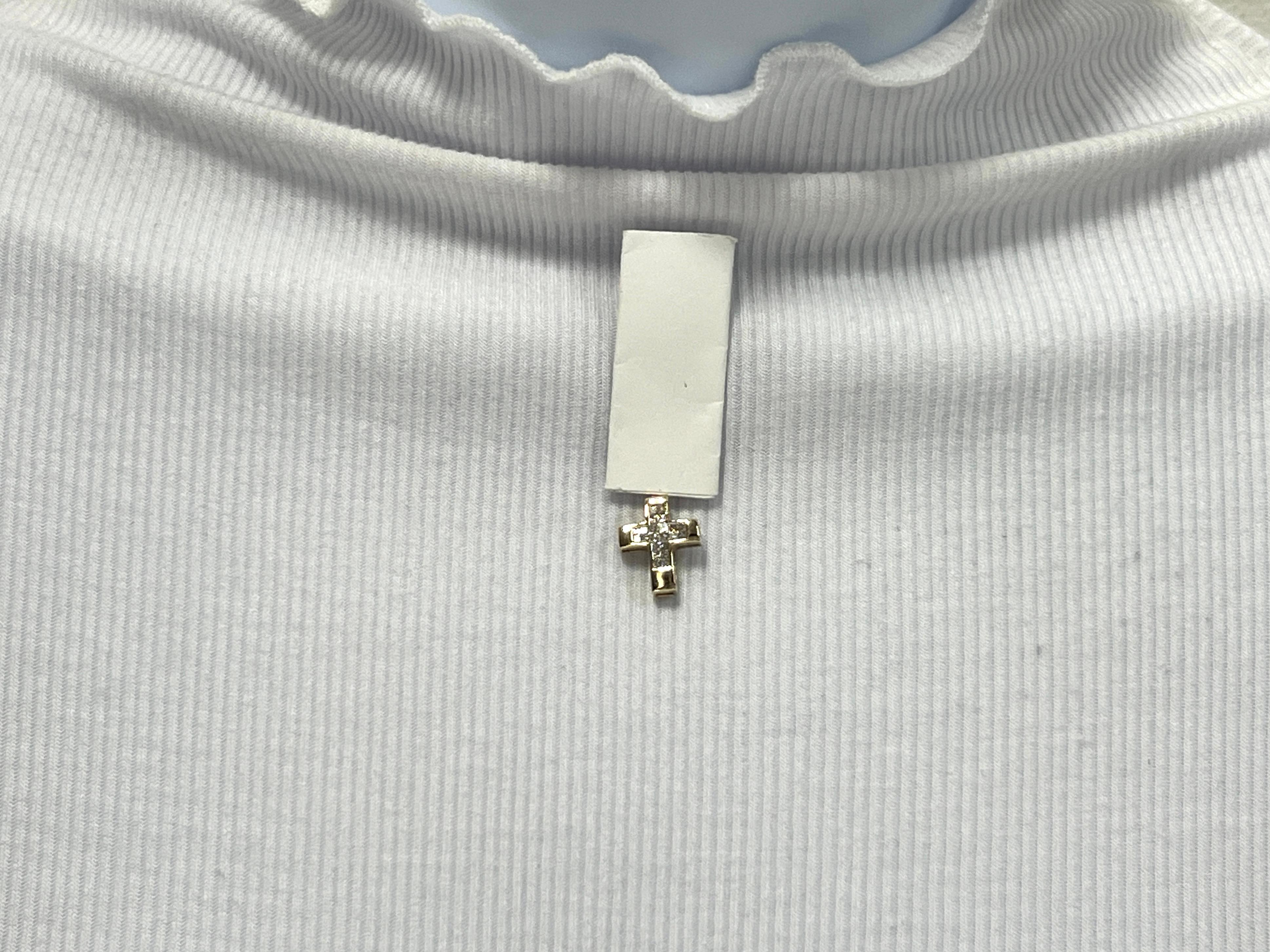 Beautiful 0.25 ct. white diamond princess cuts in a cross design.  Handmade in 14k yellow gold.  Easy to wear on any chain of choice.