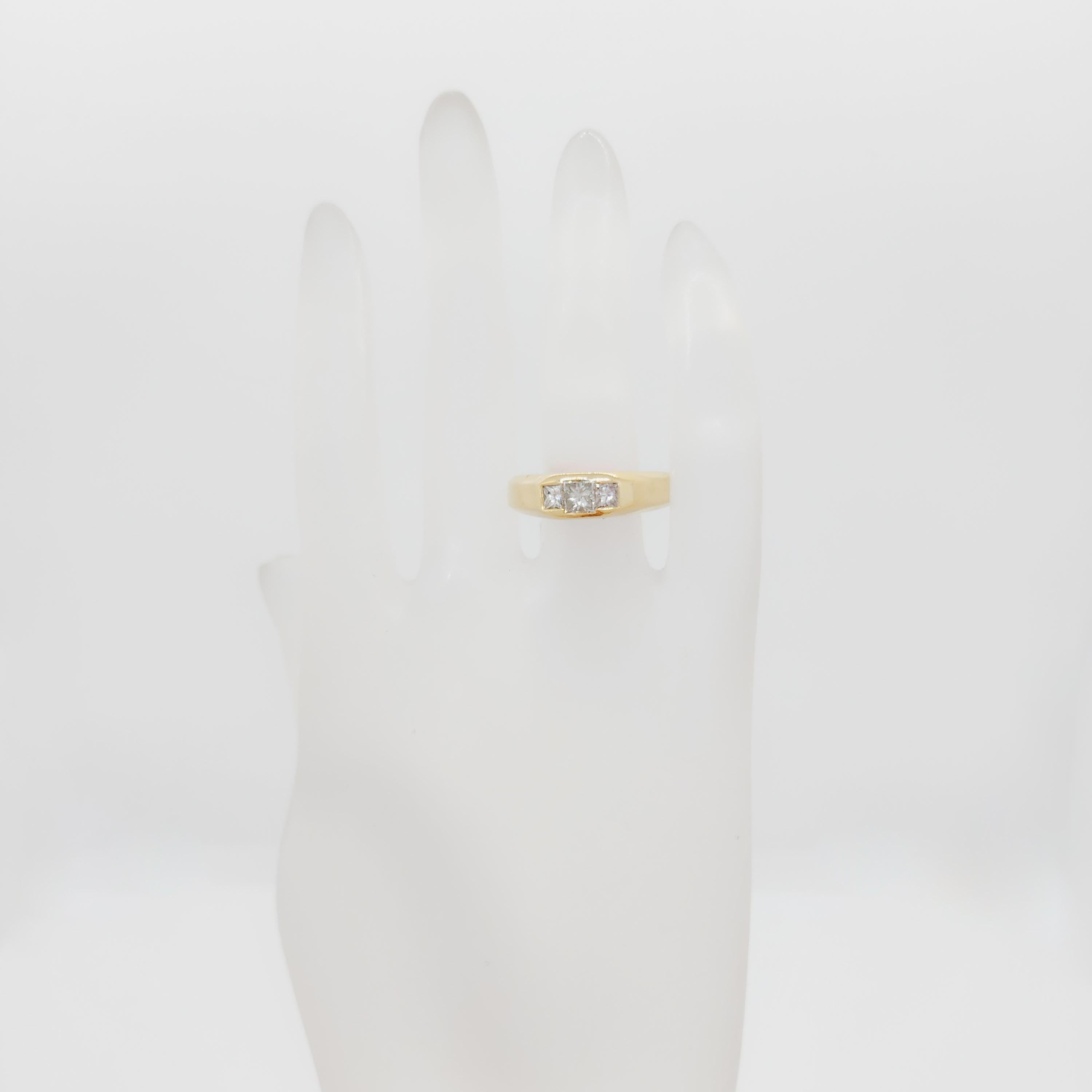 Beautiful 0.75 ct. white diamond princess cuts (3 stones total).  Handmade 14k yellow gold mounting.  Ring size 10.