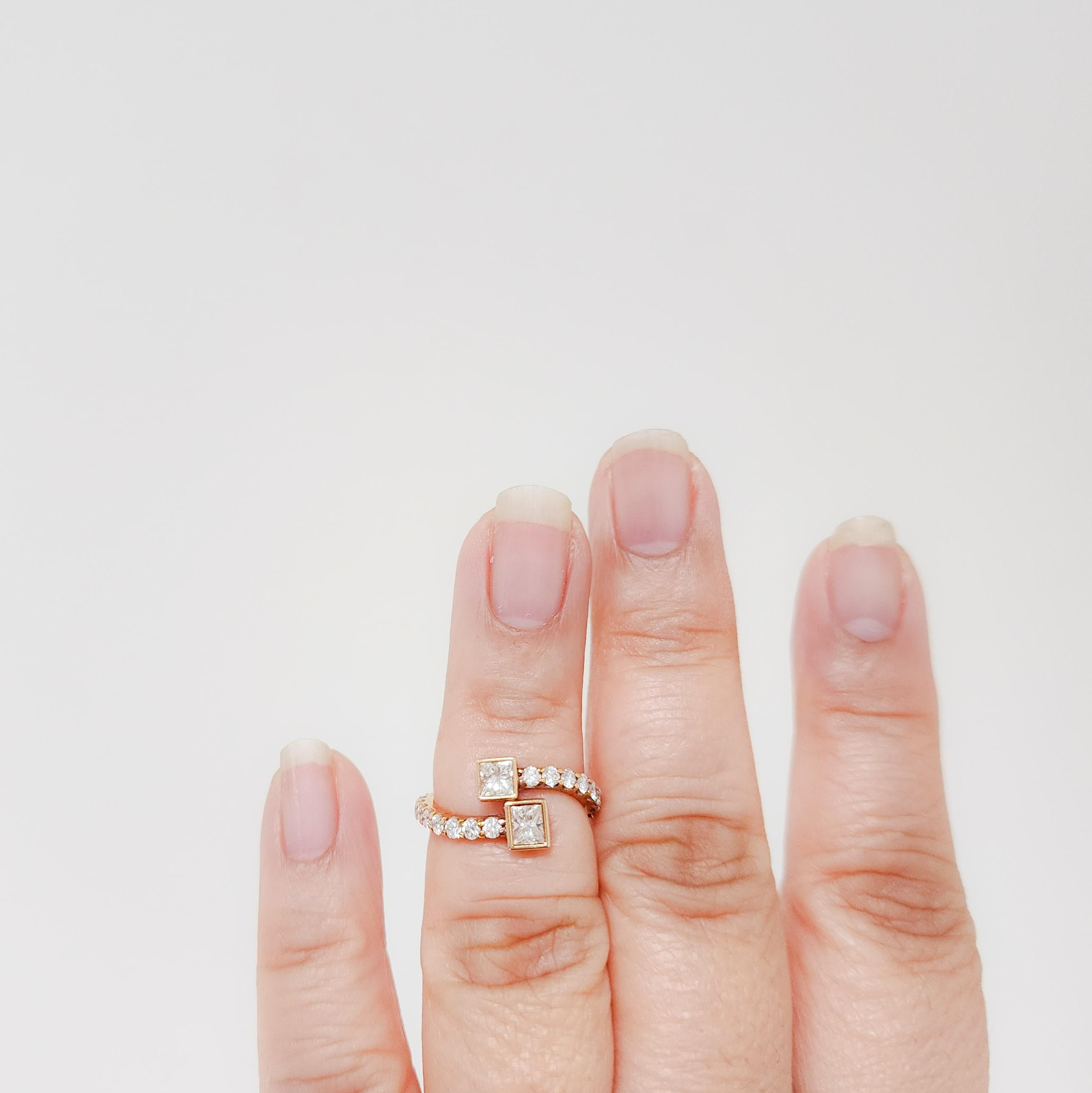 Beautiful 1.30 ct. white diamond princess cuts and rounds.  Handmade in 18k rose gold.  Ring size 5.25.