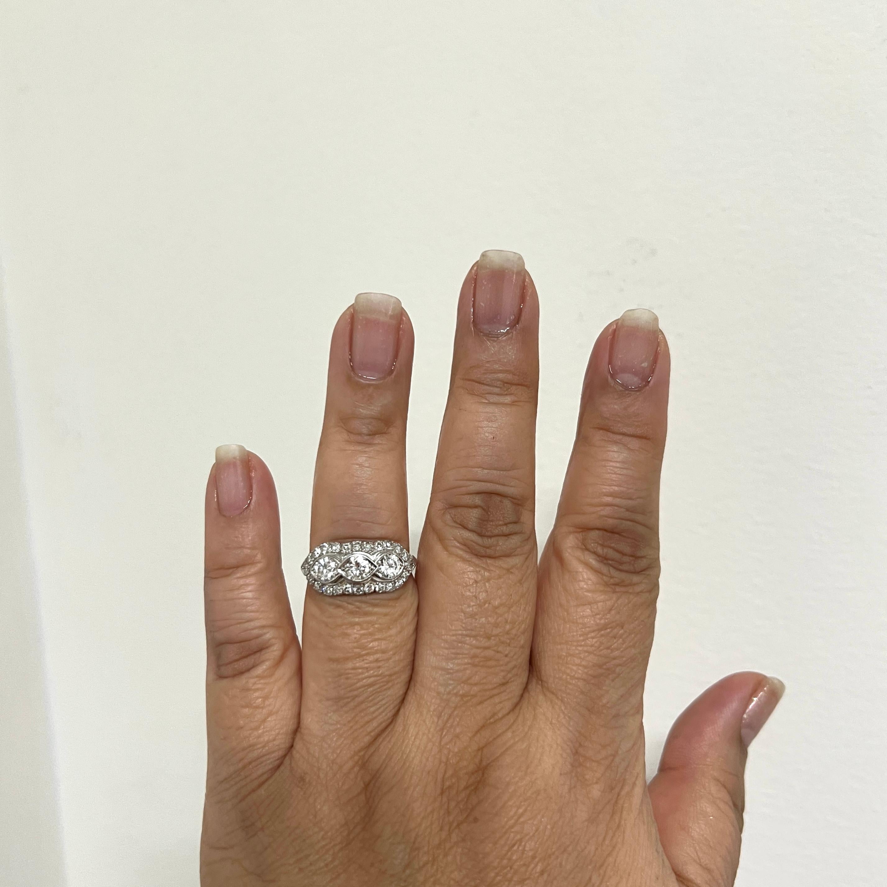 Beautiful, white, good quality diamond rounds.  Handmade in platinum.  Ring size 8.25.