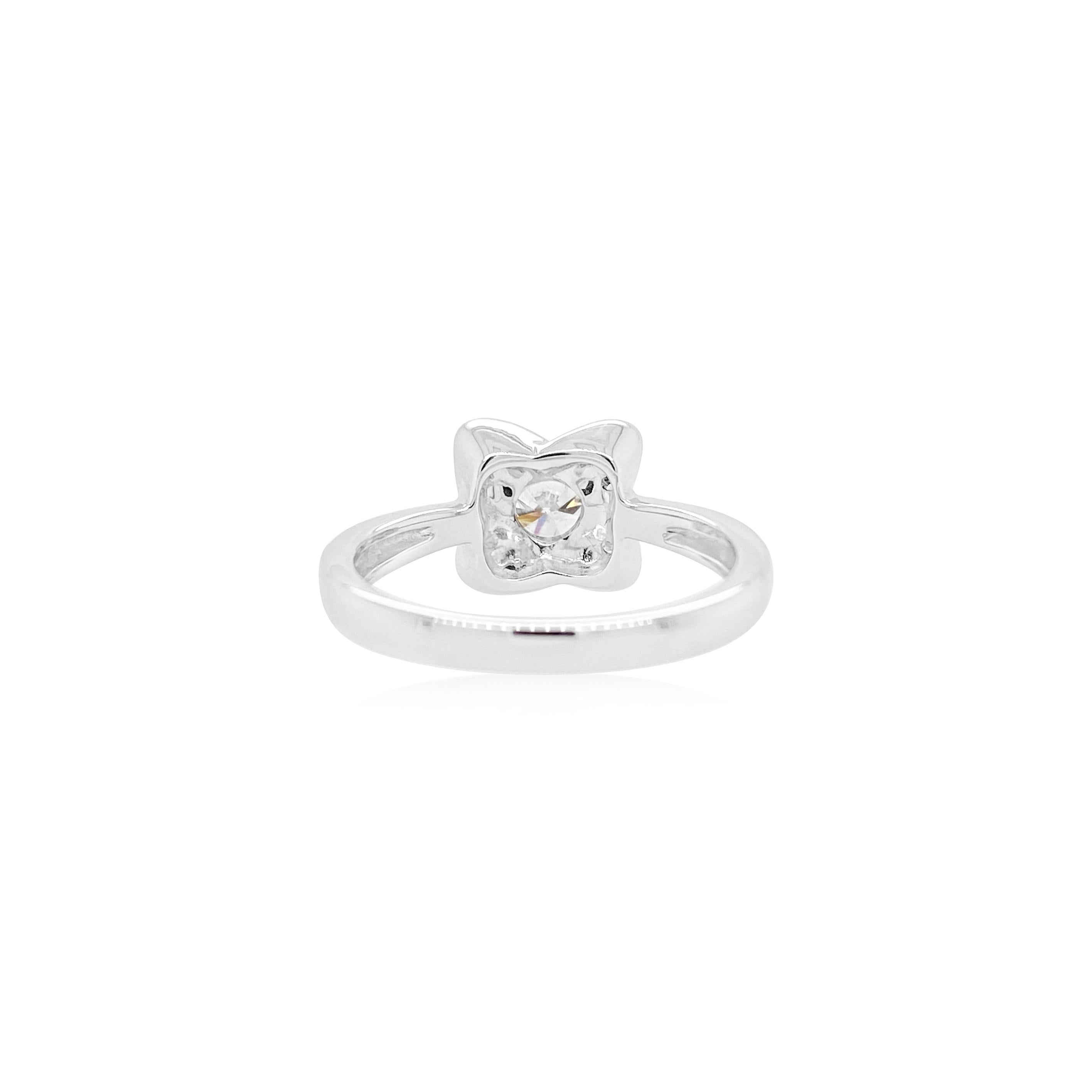This white diamond ring has a beautiful modern sleek design with a center Solitaire diamond and round white diamonds, perfect for a fancy everyday look.

- Center Diamond- 0.342 CT/ Color G/ SI2 (DGL JAPAN-1226116A)
- White Diamonds - 0.40 CT
- Made
