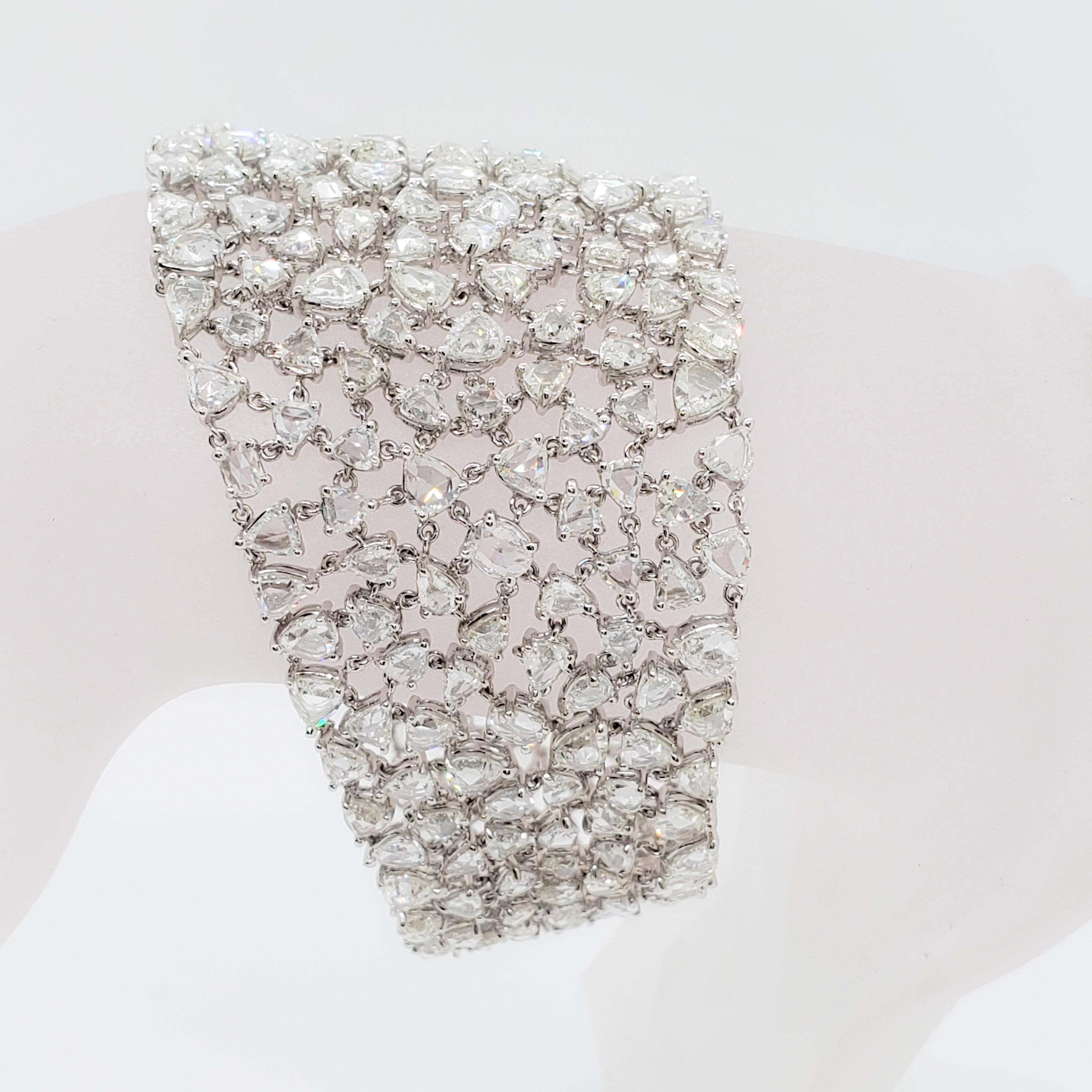 This bracelet is gorgeous with a lace like design.  Showcasing 60 carats of beautiful, clean, white diamond rose cuts (a total of 239 stones) and a handmade 18k white gold mounting.  This bracelet is a great addition to any collection and can be