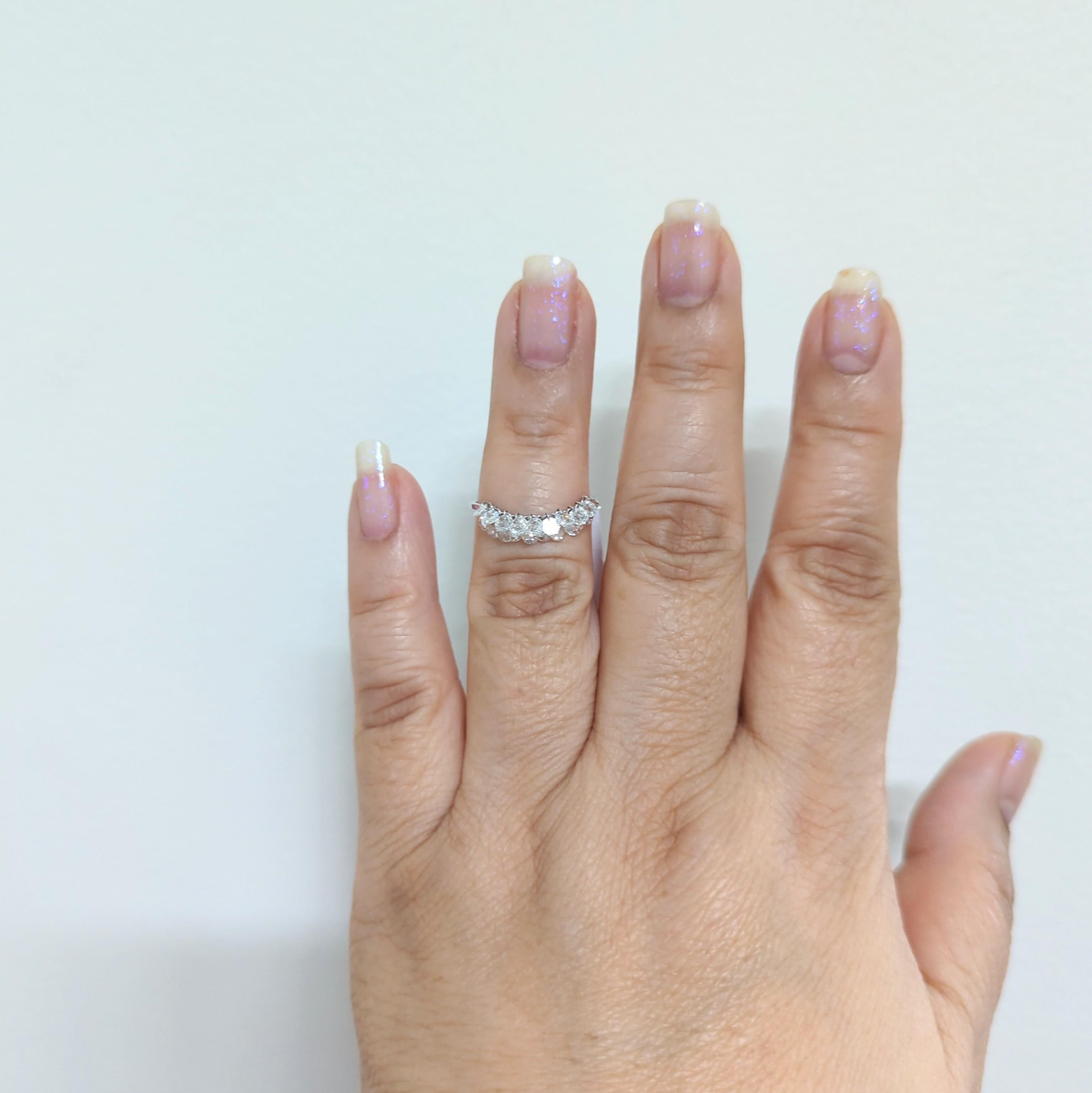 Beautiful and whimsical 1.15 ct. good quality white diamond rose cuts in this dainty ring. Handmade in 18k white gold. Ring size 7.75. Stones are flexible, giving movement to this ring.