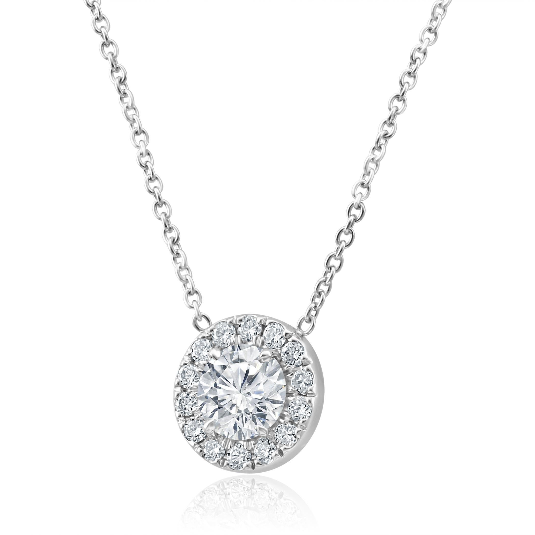 Stunning 1 White Colorless Diamond G-H Color SI-I Clarity 1.05 Carat encircled in a single halo of 14 G-H Color SI Round Diamonds 0.25 Carat set in 14K White Gold Solitaire Everyday wear Perfect for all occasion Necklace.

Style available in
