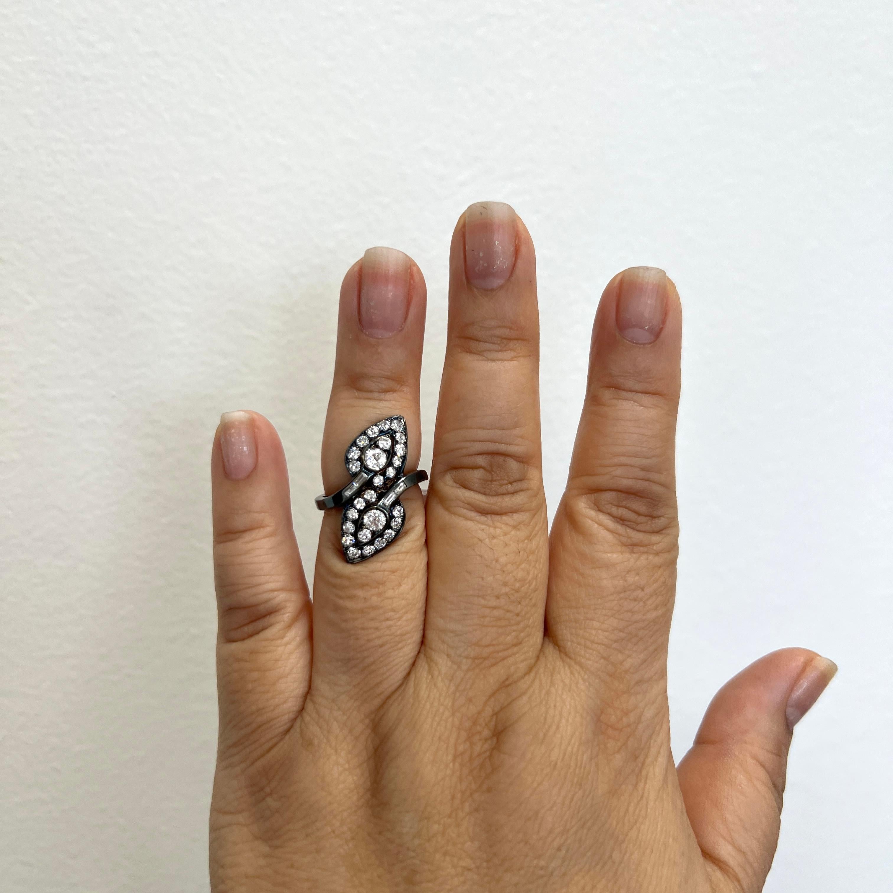 Beautiful ring with good quality, white, and bright diamond rounds and baguettes.  Handmade in 14k white gold and black rhodium.  Ring size 6.  