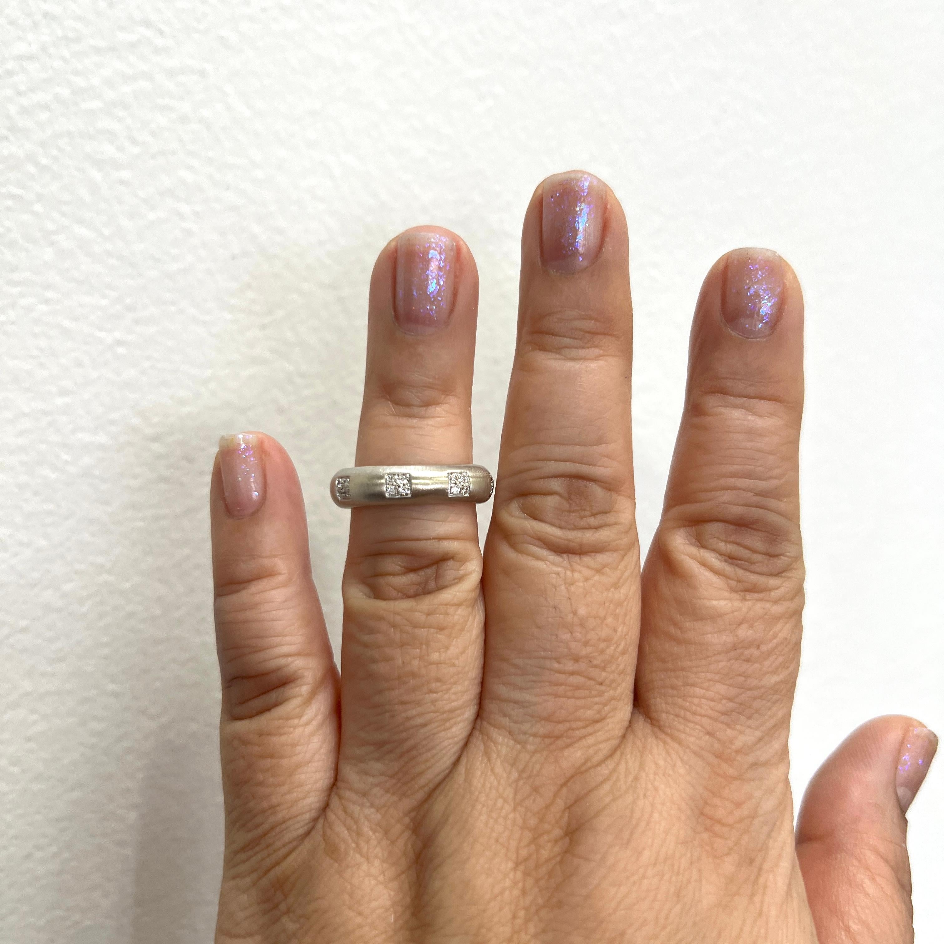 Beautiful good quality, white, and bright diamond rounds.  Handmade in 18k white gold.  Size 7.25.