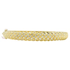 Bracciale rotondo con diamanti bianchi in oro giallo 18K