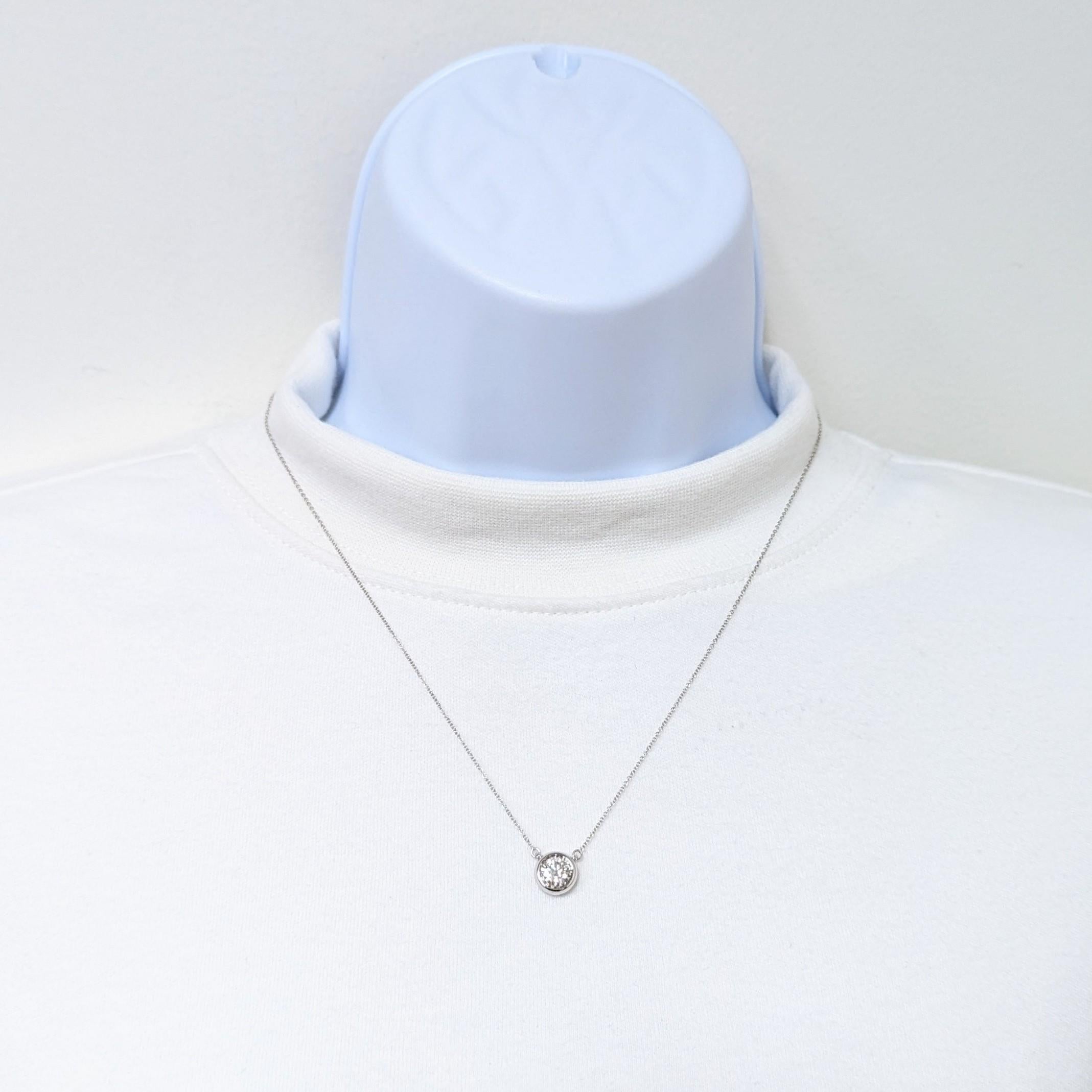Beautiful 1.12 ct. white diamond round bezel pendant handmade in 14k white gold.  Length is 18
