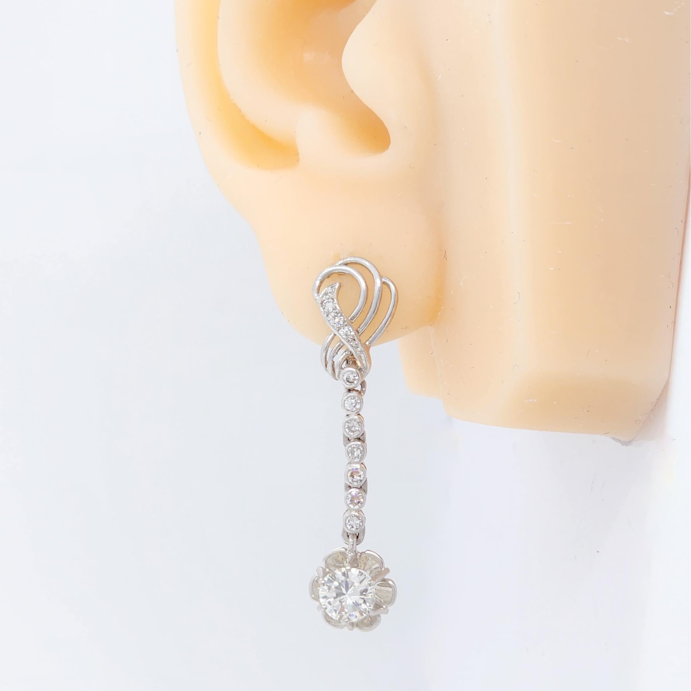 Beautiful white diamond round dangle earrings with good quality diamonds.  Handmade in 18k white gold.  Approximately 1.50 ct. of diamonds.