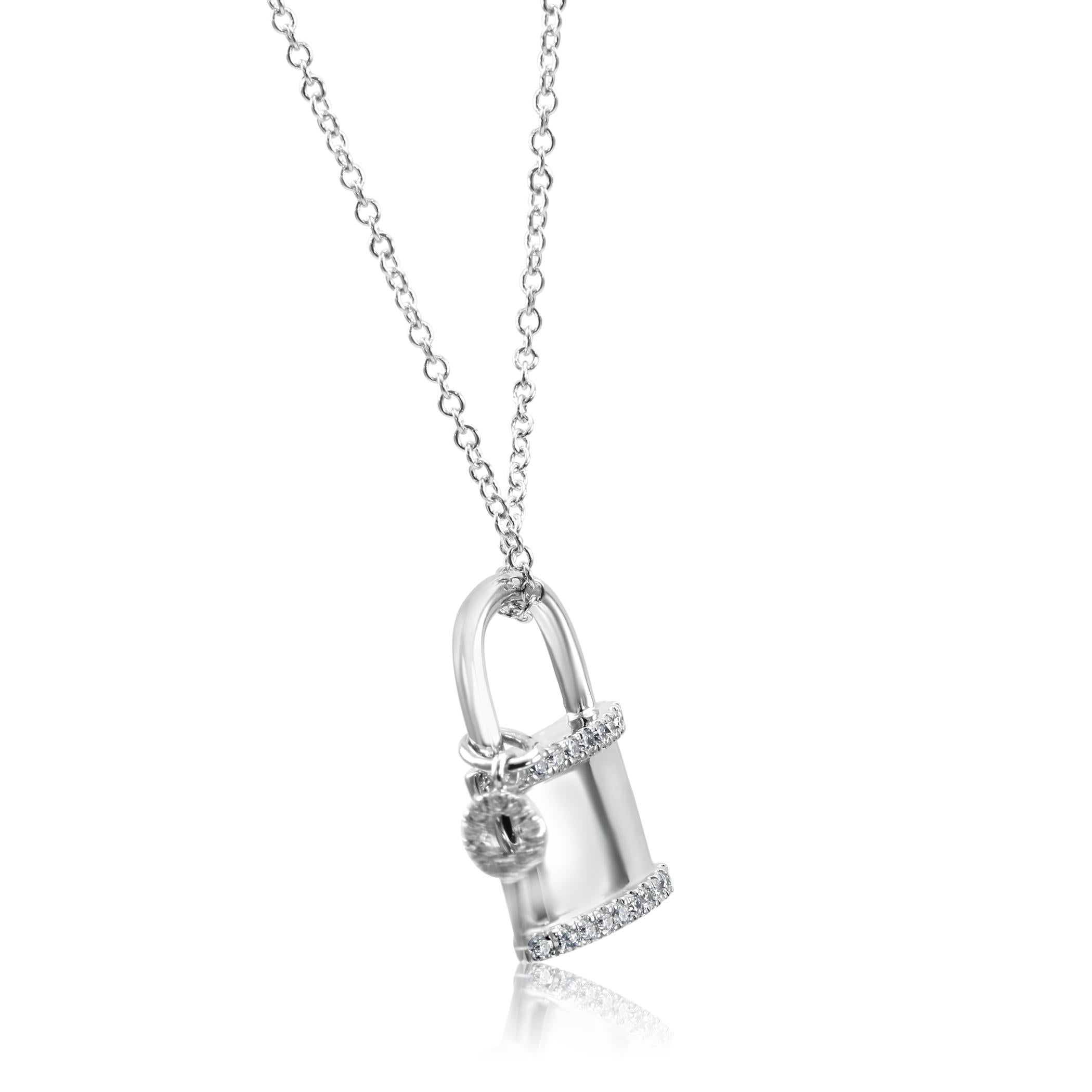 31 White G-H Color SI Diamond Round 0.18 Carat set in Lock and Key Style Fashion Drop Pendant Chain Necklace in 14K White Gold. 

Total Diamond Weight: 0.18 Carat

Metal: 14k White Gold

Pendant Measurements: Width 0.75 Inch Length 0.5 Inch

Chain