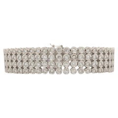 Bracelet à quatre rangées de diamants blancs ronds en or blanc 18 carats