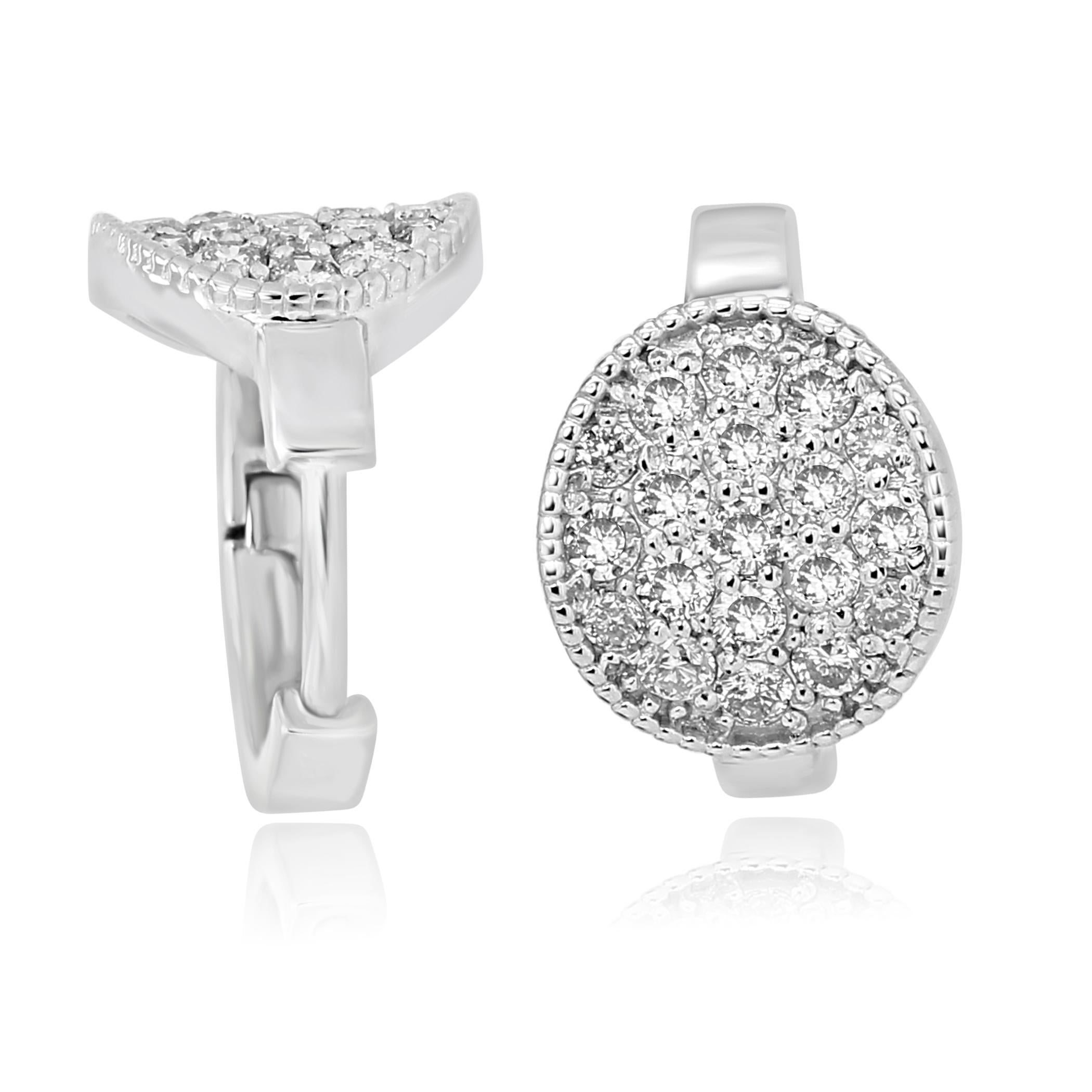 Stunning every day wear 14K White Gold Clip on Earring with White Diamond Round 0.64 Carat with Filigree on the side.

MADE IN USA 