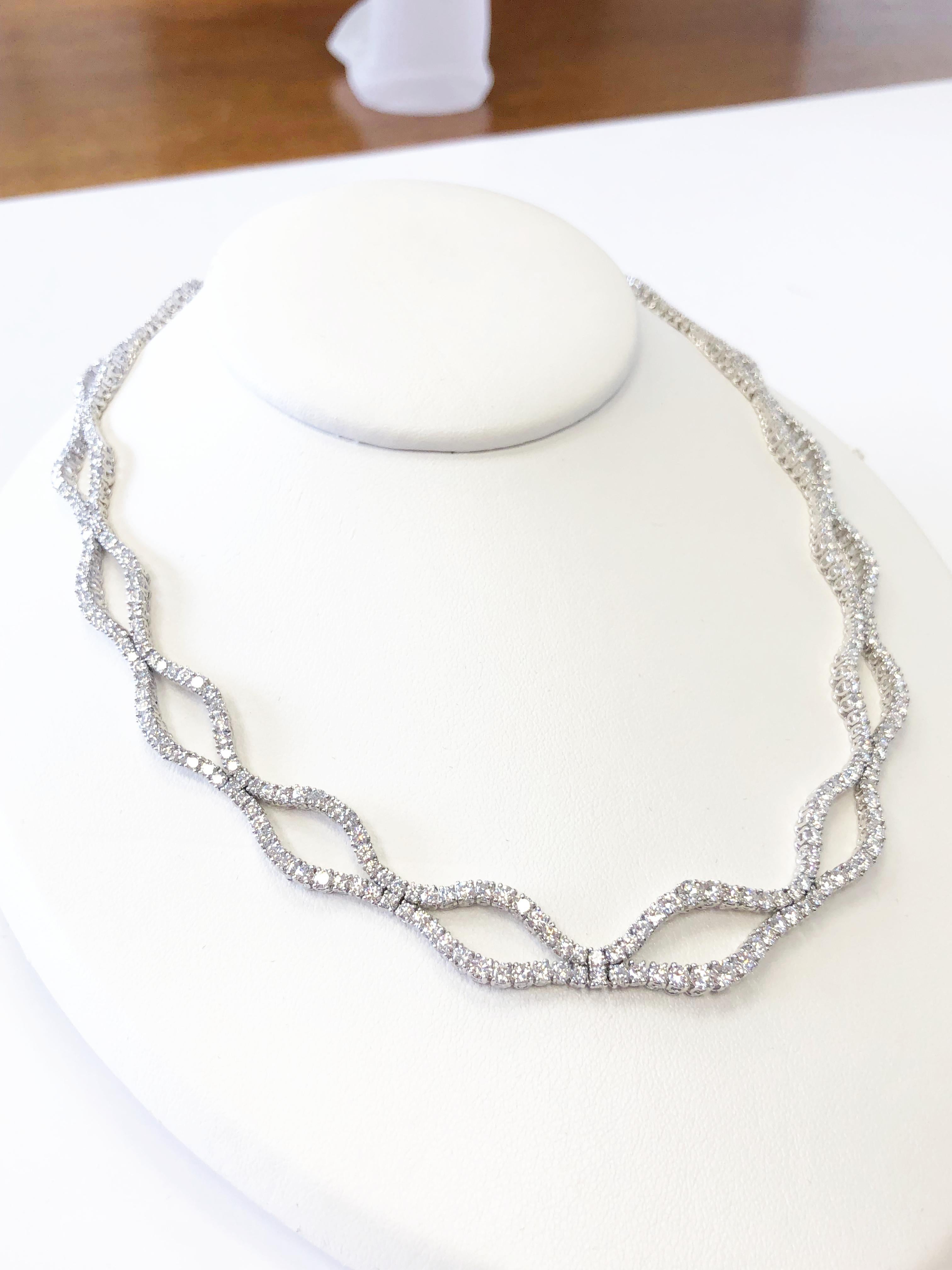 Beautifully designed white diamond round necklace and bracelet made with 28 carats of good quality, bright, and white diamonds set in platinum.  Handmade with great detail and flexibility.

