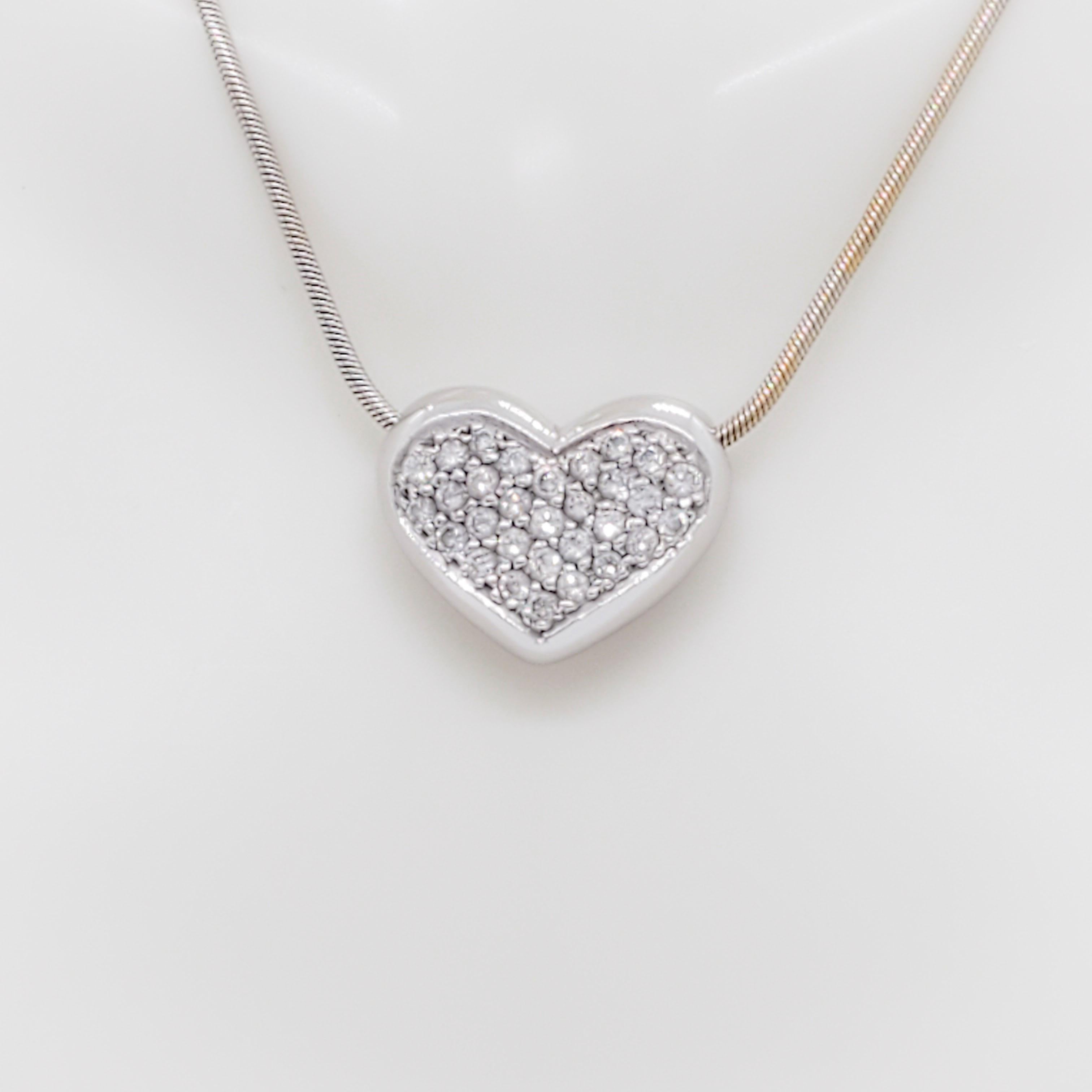 Beautiful 0.50 ct. good quality, white, and bright diamond rounds make up this pave heart pendant.  Handmade in 18k white gold.  Length is 18