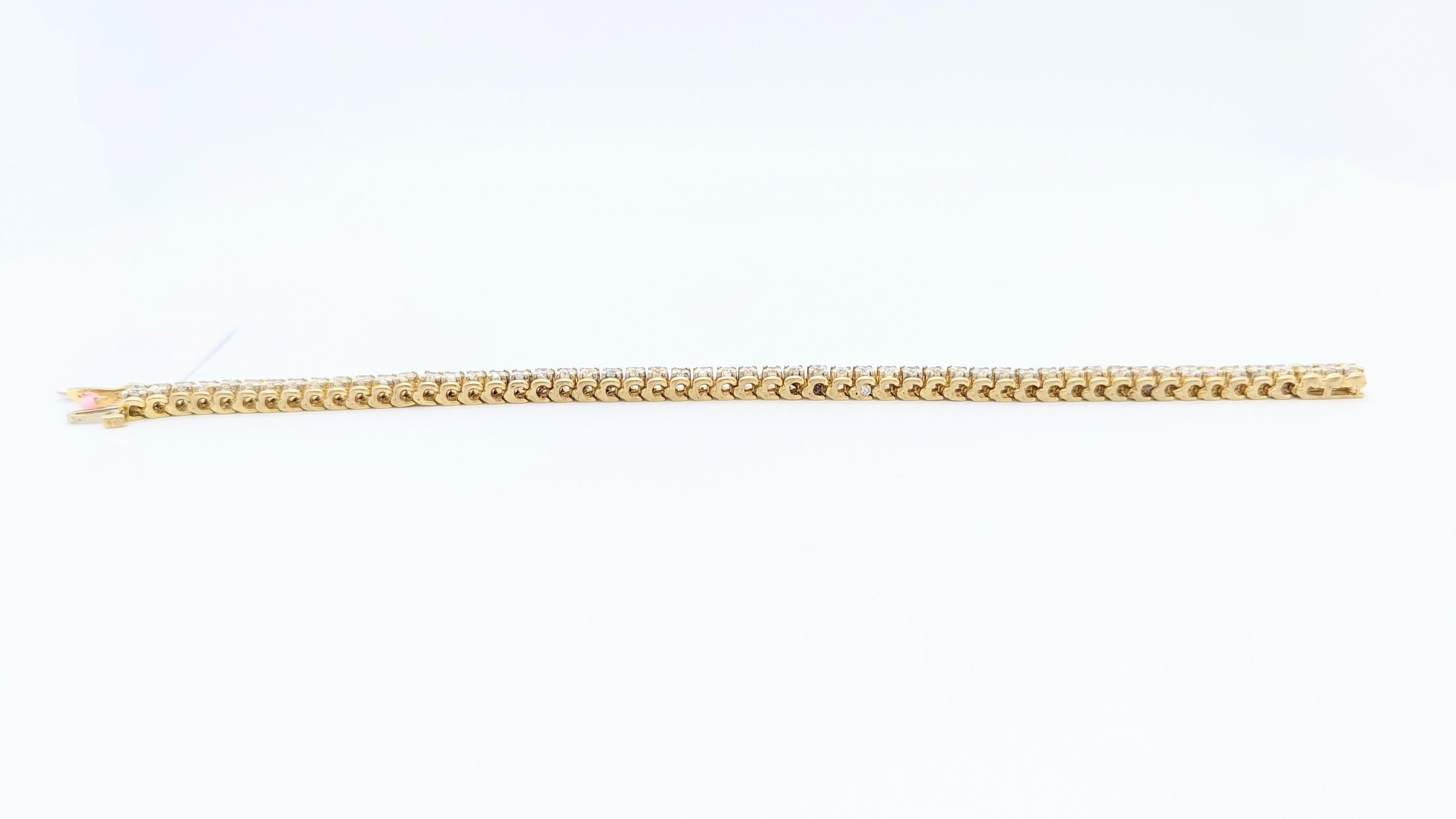 Beautiful white diamond round bracelet with 54 good quality bright stones.  Handmade in 14k yellow gold.  Length is 7