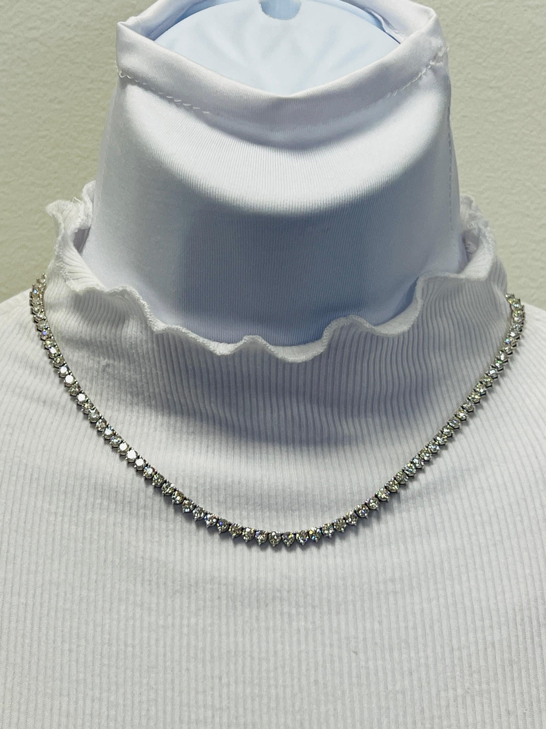 Beautiful 7.01 ct. good quality, white, and bright diamond rounds.  Handmade in 14k white gold.  Three prong setting.  Length is 16