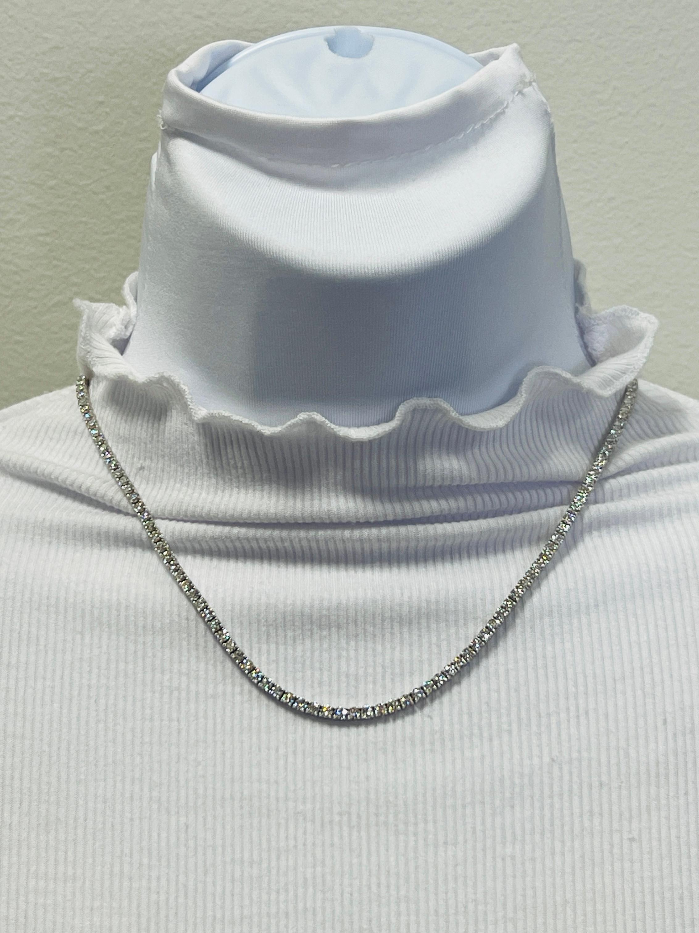 Gorgeous 12.44 ct. good quality white diamond rounds.  Total of 140 stones.  Handmade in 18k white gold.  Length is 16.5