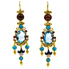 Orecchini in oro giallo con diamante bianco, rubino, topazio blu, turchese, smalto e tormalina