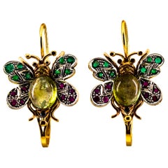 Orecchini a leva in oro giallo con diamante bianco, rubino, smeraldo, zaffiro e tormalina