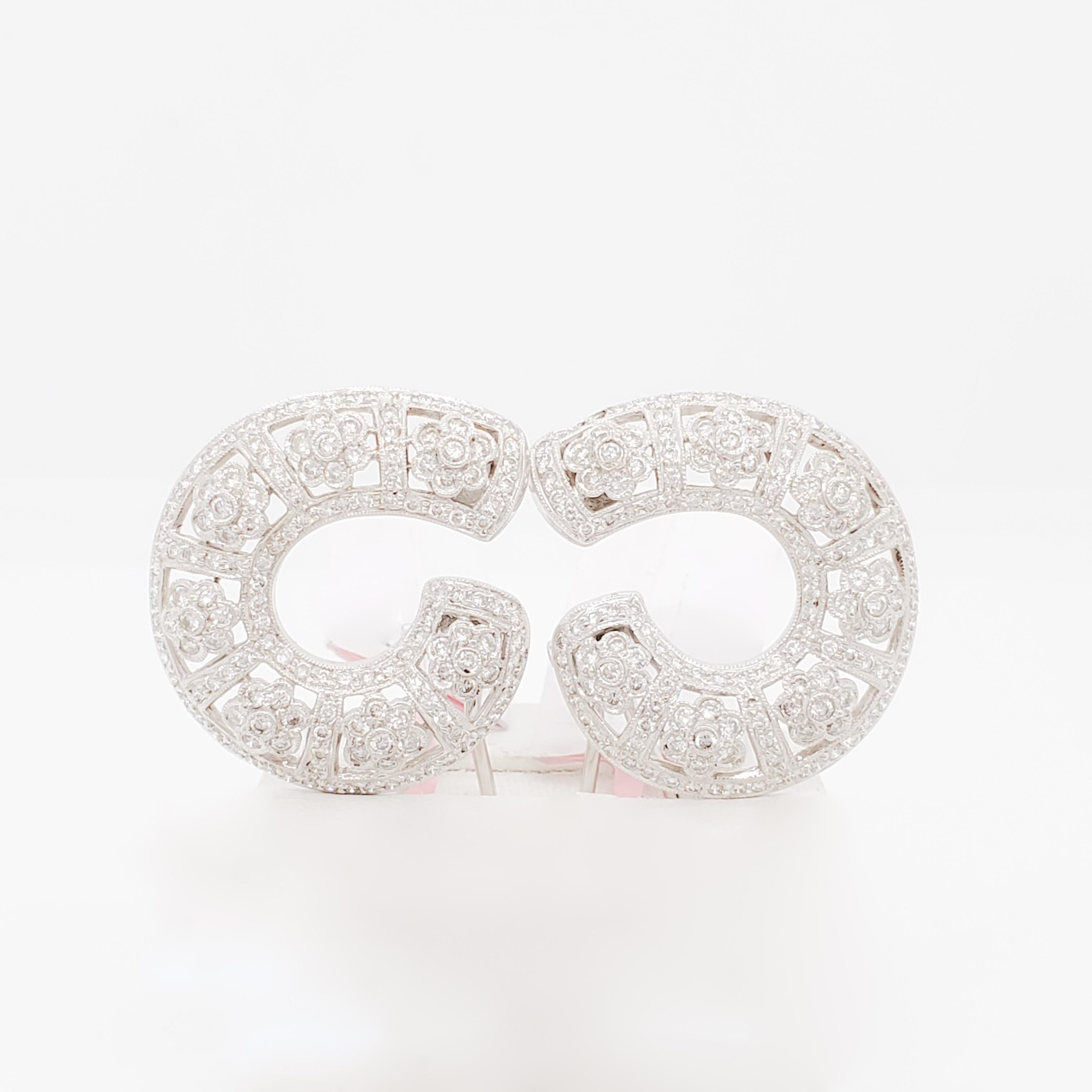 Gorgeous 3.17 ct. of good quality, white, and bright diamond rounds.  Handmade in 18k white gold.  These semi hoops are perfect for night or day!