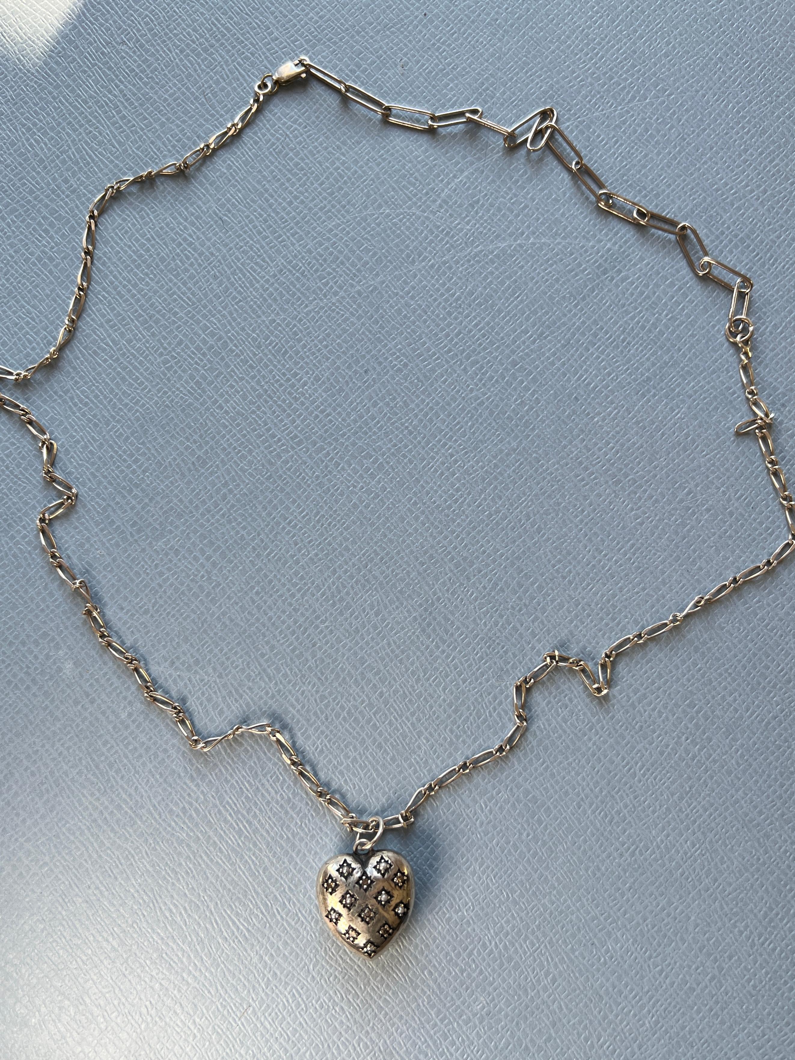 Silver Heart Necklace Victorian Style White Diamond Pearl 

Chain: Solid Sterling Silver Vintage
Heart: Solid Sterling Silver

Designer: J DAUPHIN

Length: 20 inches 

White diamonds hold significant spiritual meaning by embodying purity, clarity,