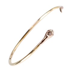 Pulsera de serpiente de diamantes blancos Brazalete de oro amarillo de 18 quilates Ojos de rubí J Dauphin