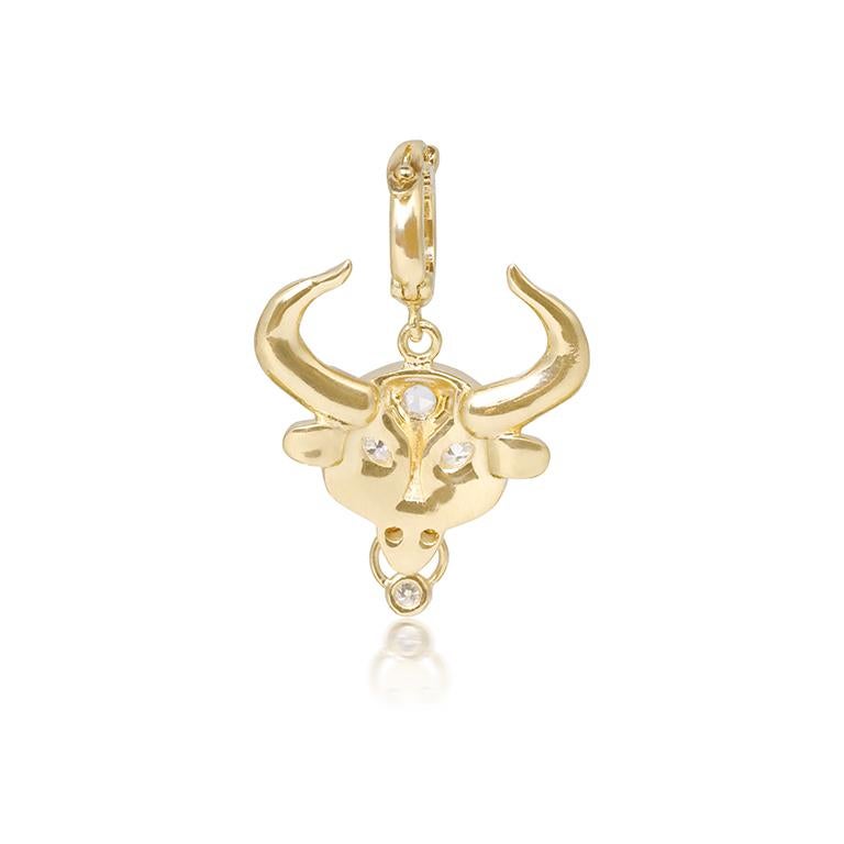 A fun twist on traditional zodiacs. 
Taurus zodiac pendant crafted in 18k gold, white enamel and white diamonds. The diamond encrusted bezel opens to allow you to securely hook it to any of your chains.

- 18K Yellow, rose or white gold 
- 0.11 CT