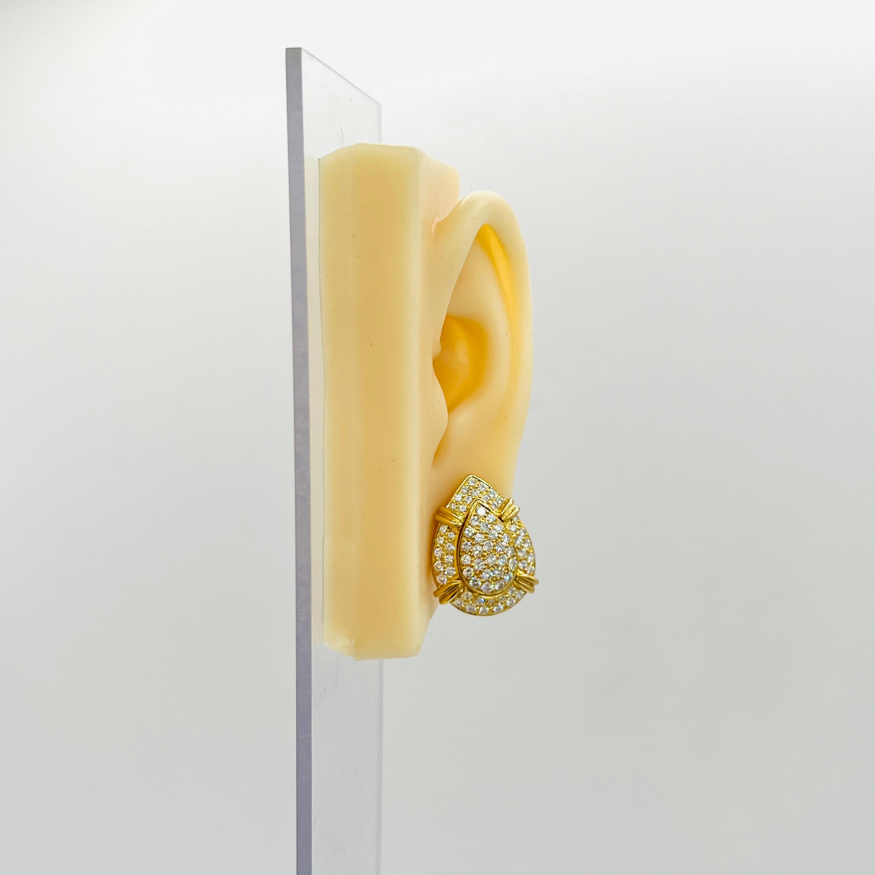 Beautiful 2.50 ct. white diamond rounds.  Handmade in 18k yellow gold with lever back.  These earrings can be worn two ways, as a pave tear drop stud or with the extra pave border.  