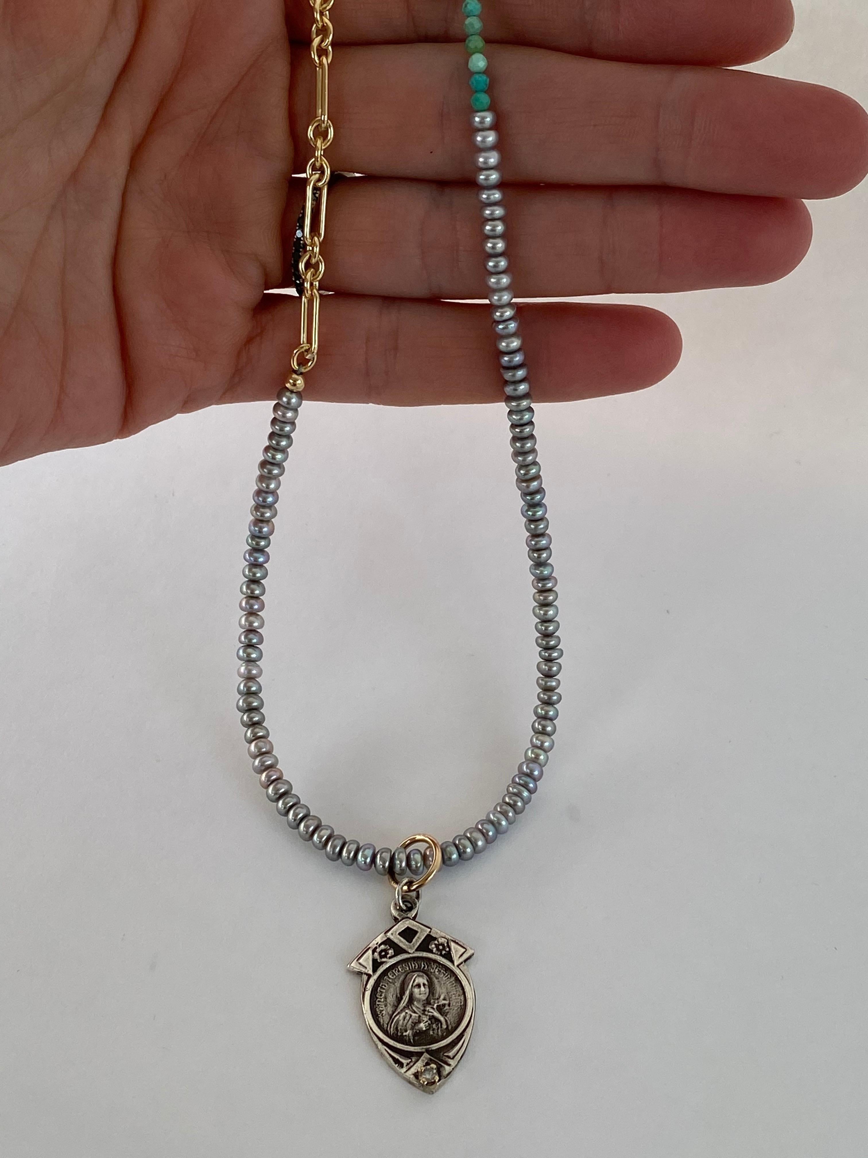 Medal Virgin Mary Necklace Bead Silver Pendant Pearl Turquoise J Dauphin

Exclusive piece with a Virgin Mary Medal in Silver with a White Diamond set in a Gold Prong with a silver sweatwater pearl, turquoise and gold filled Chain. 

Symbols or