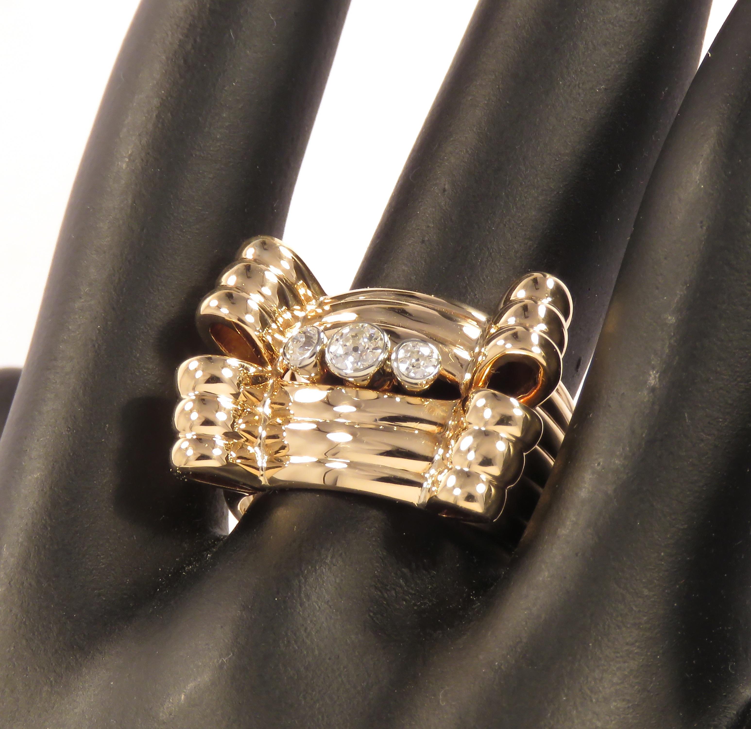 Elegant vintage ring crafted in 18 karat yellow and white gold with 3 white brilliant cut diamonds, circa 0.20 ctw. Size of the upper part of the ring is 23x16 mm / 0.905x0.629 inches. US finger size is 6 3/4, French size 54, Italian size 14,