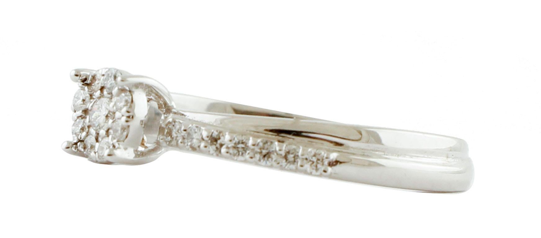 Elegant and unique solitaire/engagement ring realized  in 18k white gold studded with 0.26 ct of little white diamonds.
Central Part Diameter 5 mm X 5 mm 
Diamonds 0.26 ct 
Total Weight 2.80 g 
R.F + ggfa
Italian Size 14.5
French Size 54.5
Usa Size