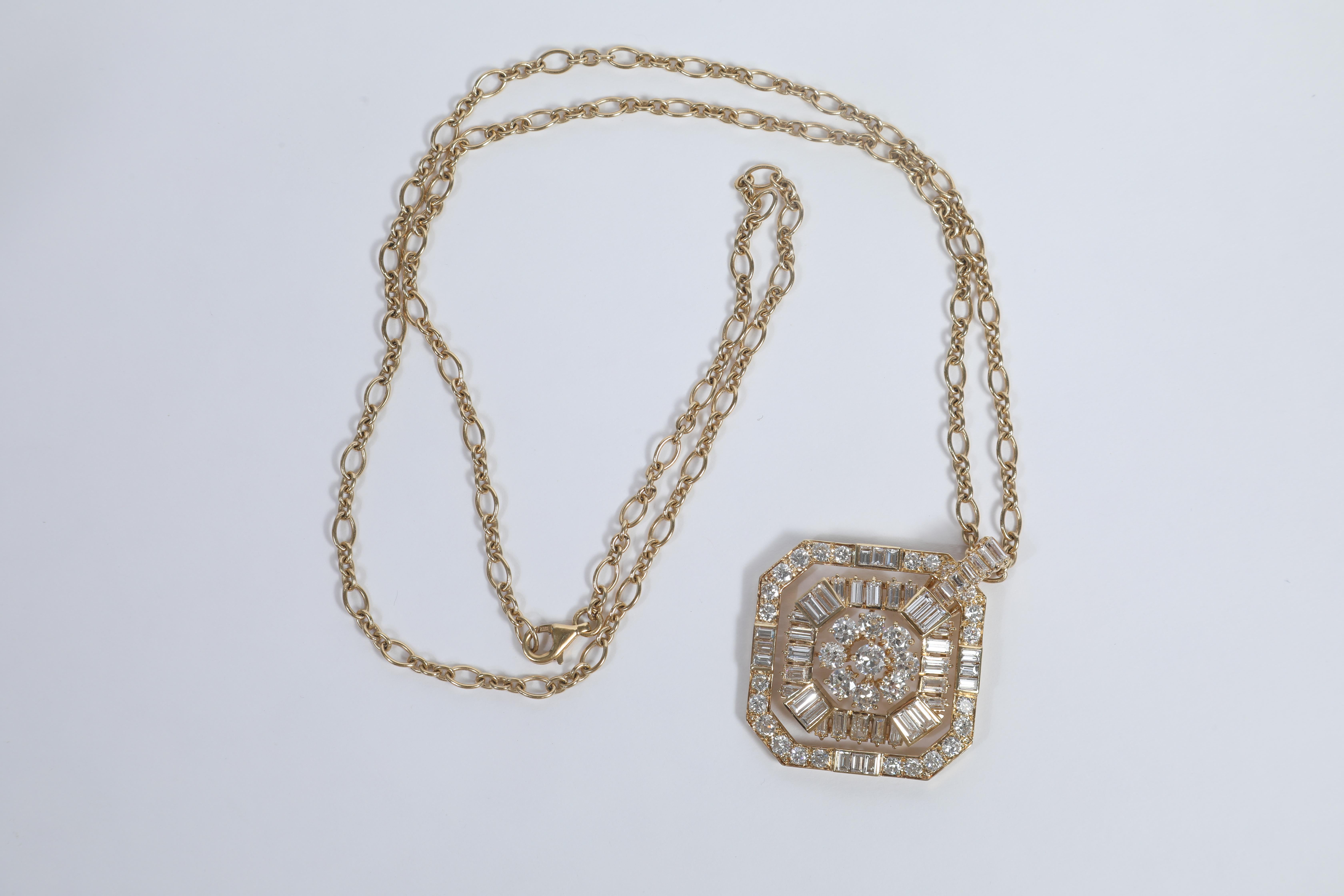 White diamonds and 18K yellow gold pendant, created in 1982
Typical luxurious jewel from the eighties
Diamonds weight: 8.77carats
18K gold chain weight: 18.98grams
Total weight: 37.96 grams
18K Gold chain lenght: 71.5cm
French assay mark