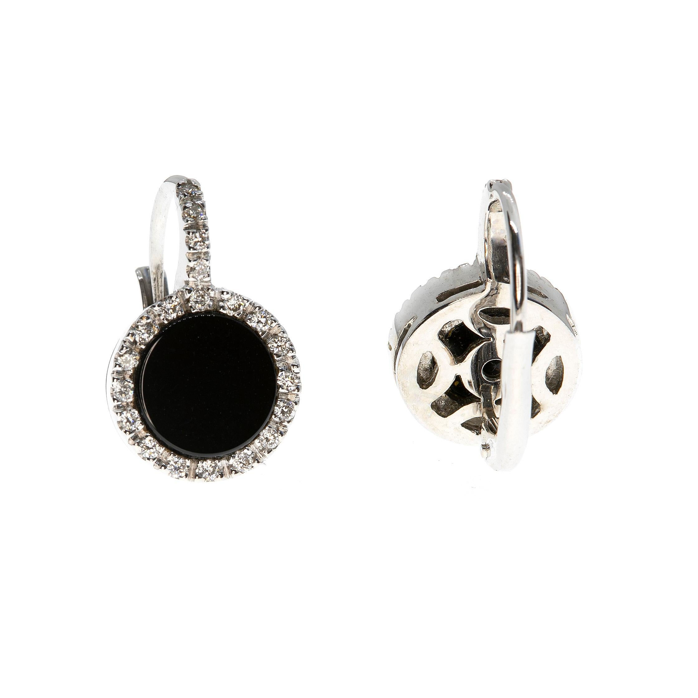 These earrings, masterfully created by hand from 18-karat white gold are set with a large onyx and a brilliant white diamond halo.

They are exceptional to view and easy to wear with bridge and spring clip backs. They measure just under 17