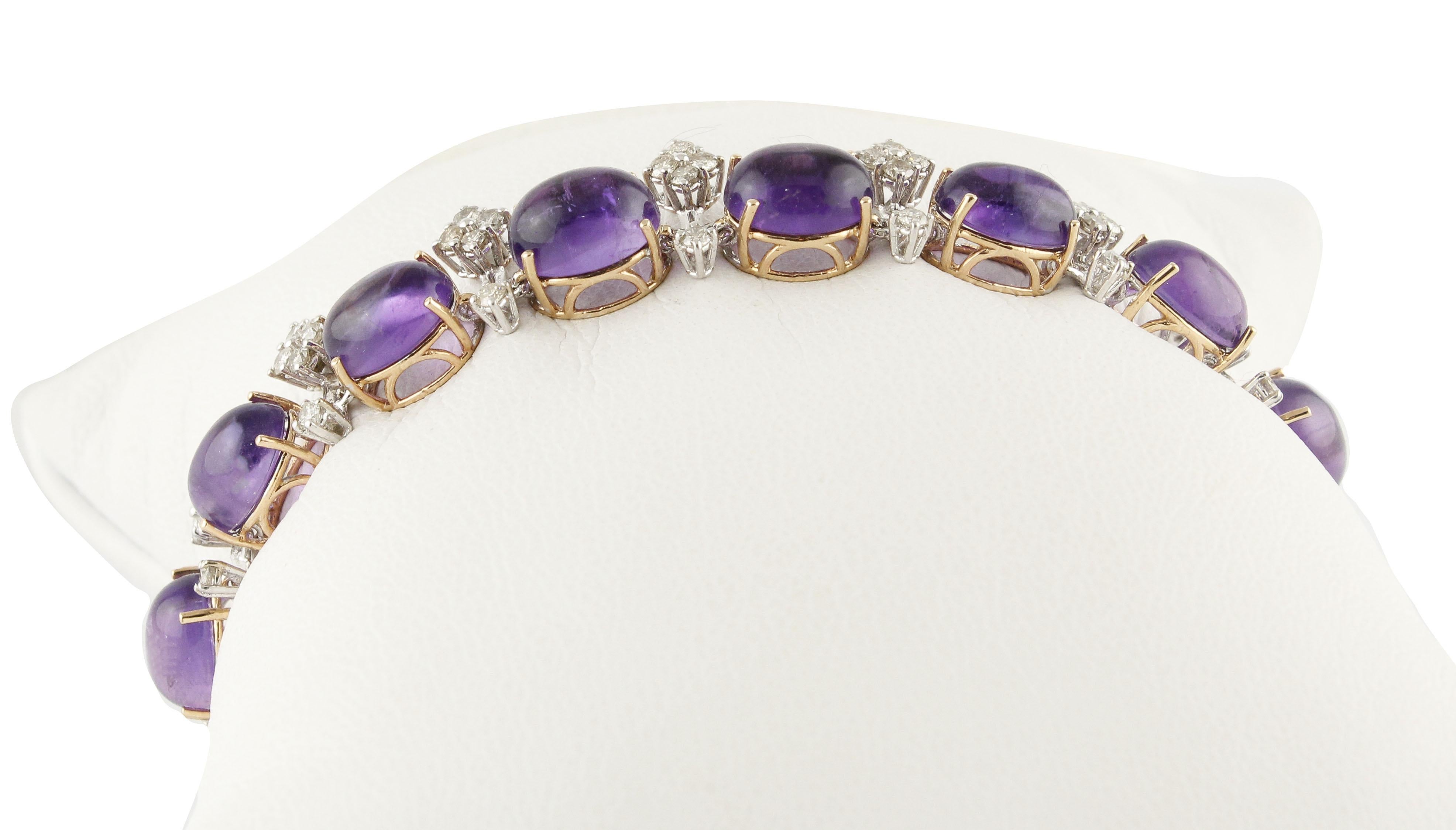 Elegant and refine link bracelet in 14K white and rose gold composed of small white diamonds detailes and a row of deep color cabochon cut amethysts 
Diamonds 2.45 ct 
Amethysts 29.61 ct 
Total Weight 17.10 g 
R.F + oogf
Length 18.50 cm 
Width 1 cm
