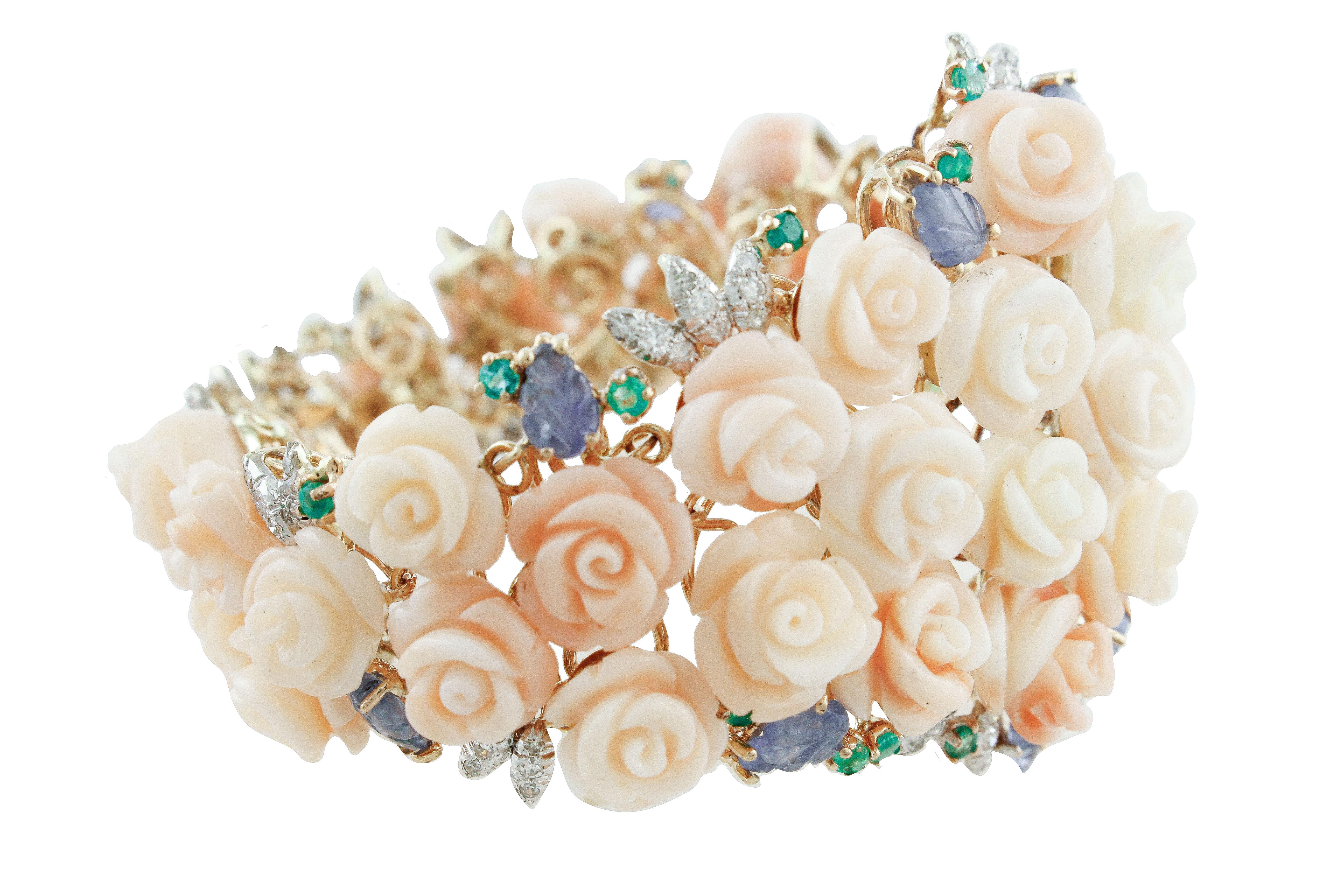 Refine and elegant 14K rose gold semi-rigid bracelet composed of light pink coral flowers, 14K white gold leaves detailes studded by diamonds, blue sapphires leaves and emeralds
Diamonds 1.61 ct 
Blue Sapphires, Emeralds 10.81 ct 
Pink Coral Flowers