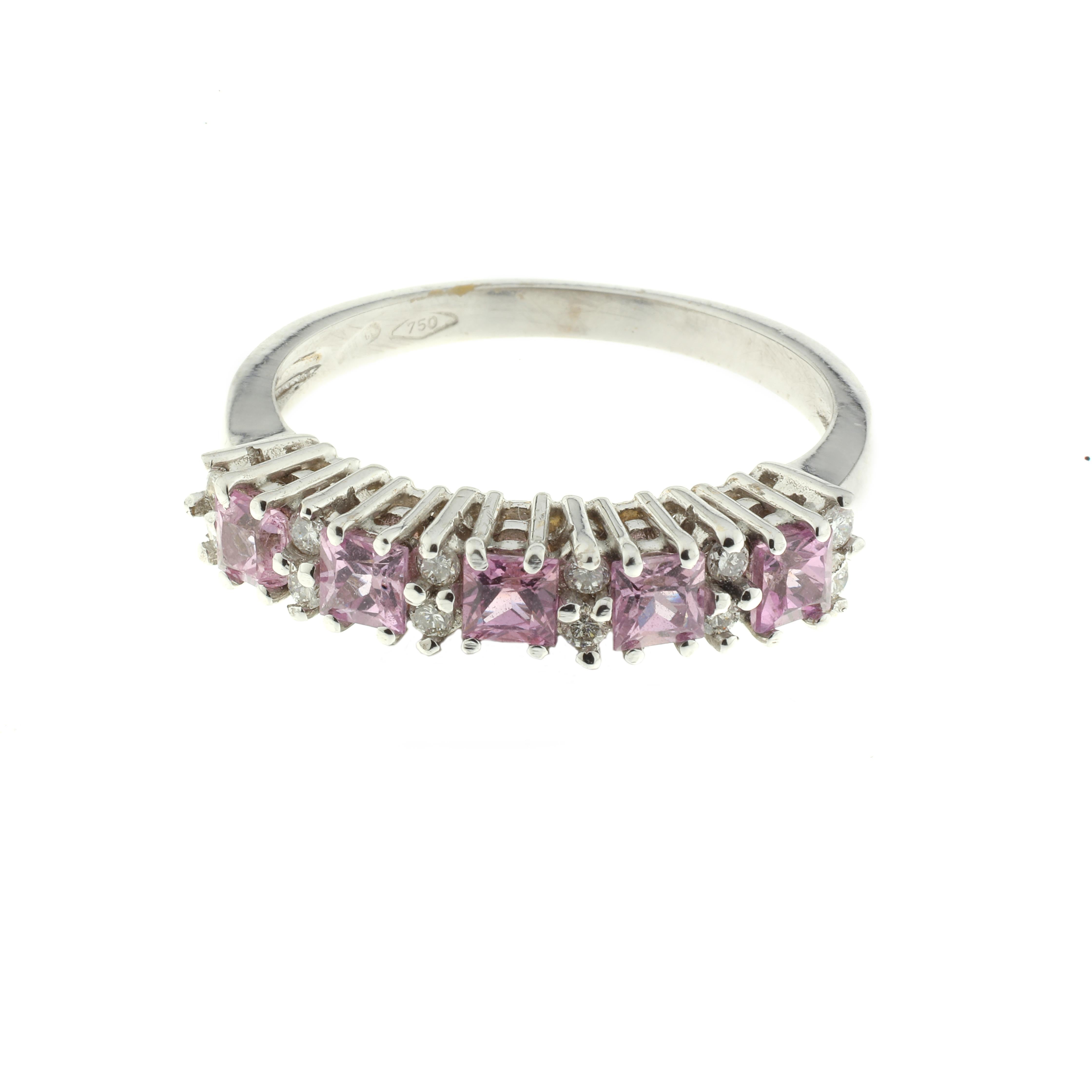 A beautiful ring, masterfully created entirely by hand and featuring carefully selected pink sapphires and white diamonds. The ring is 18-karat white gold.

The ring is equally beautiful on its own or as the jewel of a stack of rings. The