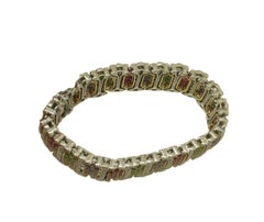 Gliederarmband aus Weiß- und Roségold mit weißen Diamanten, Rubinen, Smaragden und blauen Saphiren